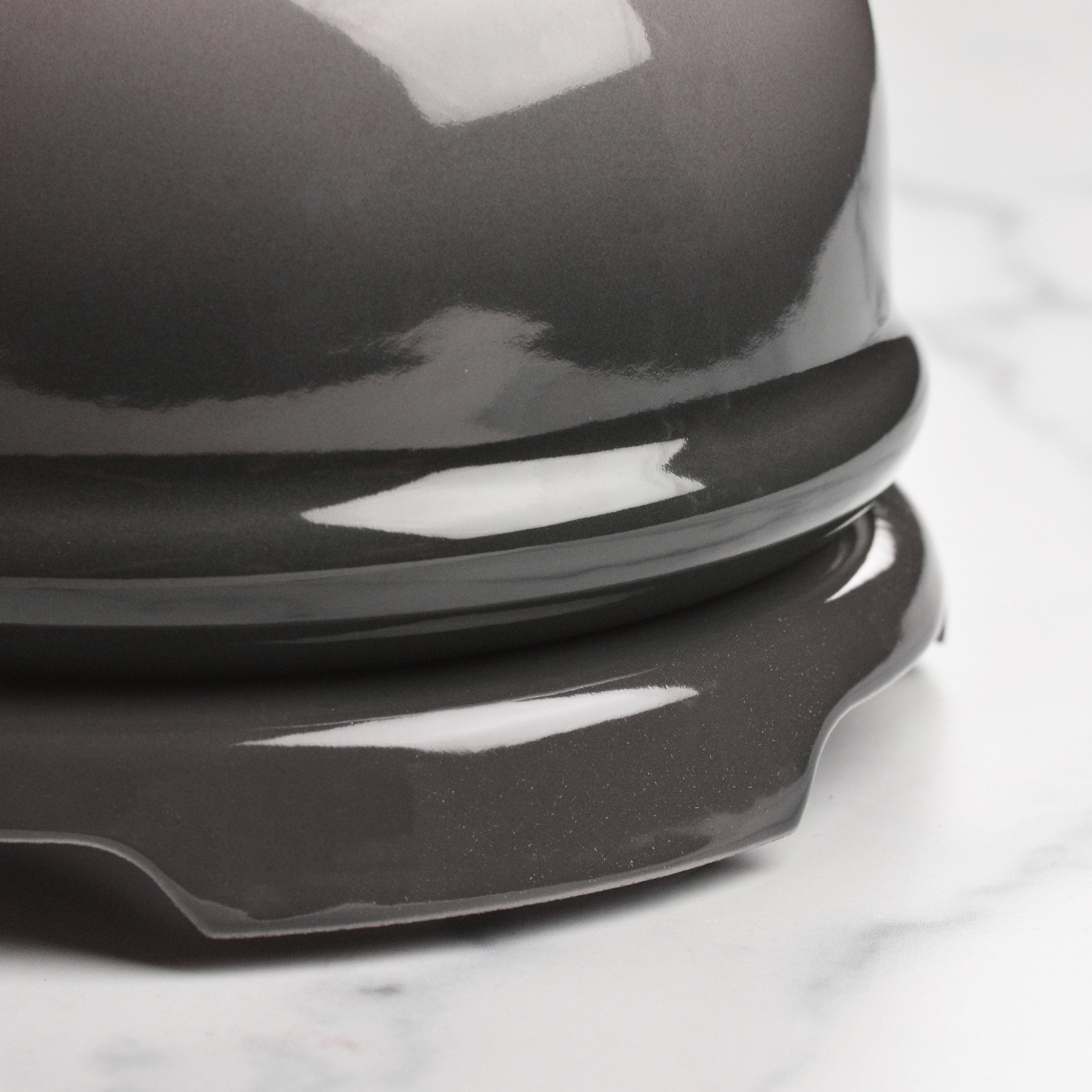 Close-up of Le Creuset signature cast iron trivet highlighting its enamel finish.