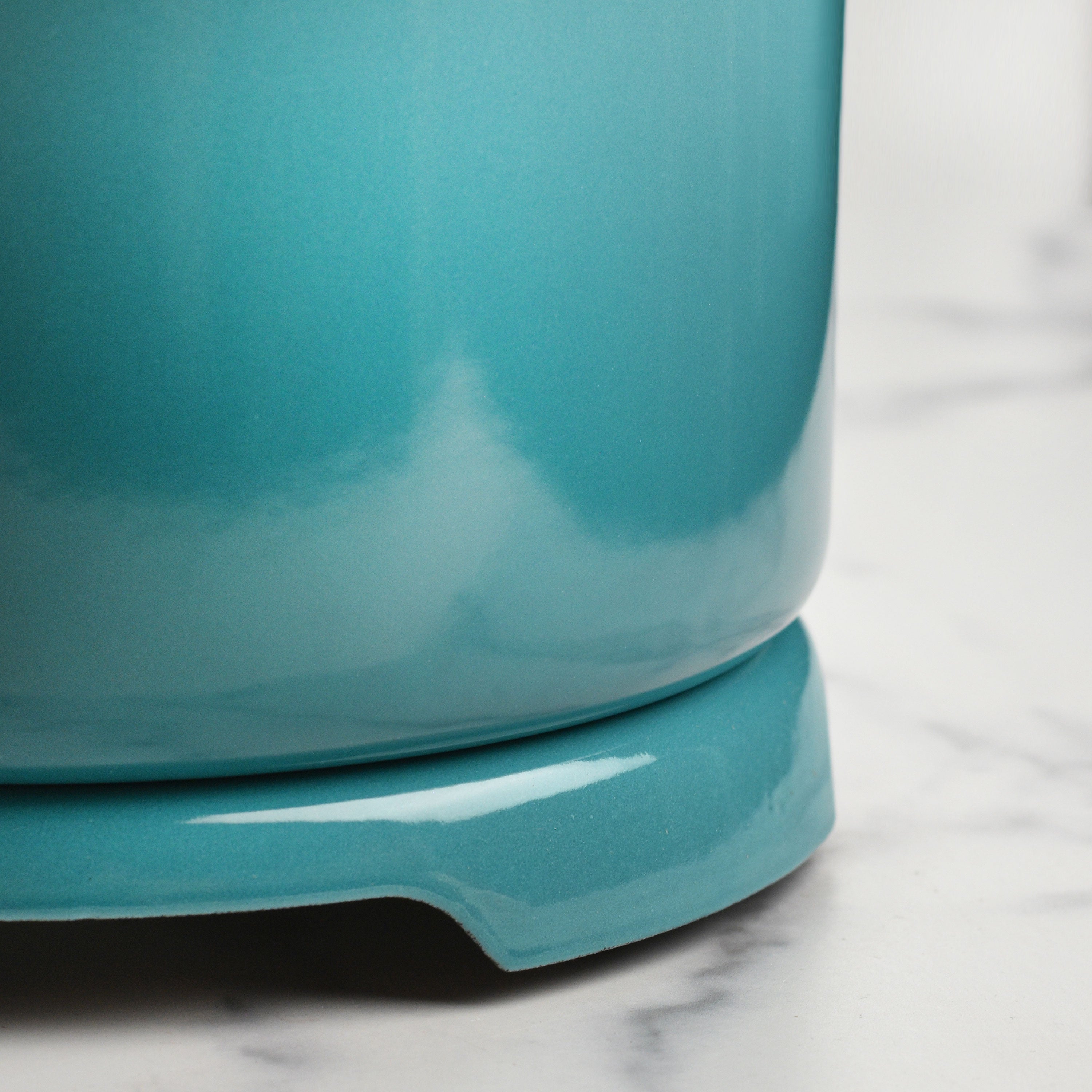 Heat-resistant trivet on a dining table, protecting the surface from a hot dish.
