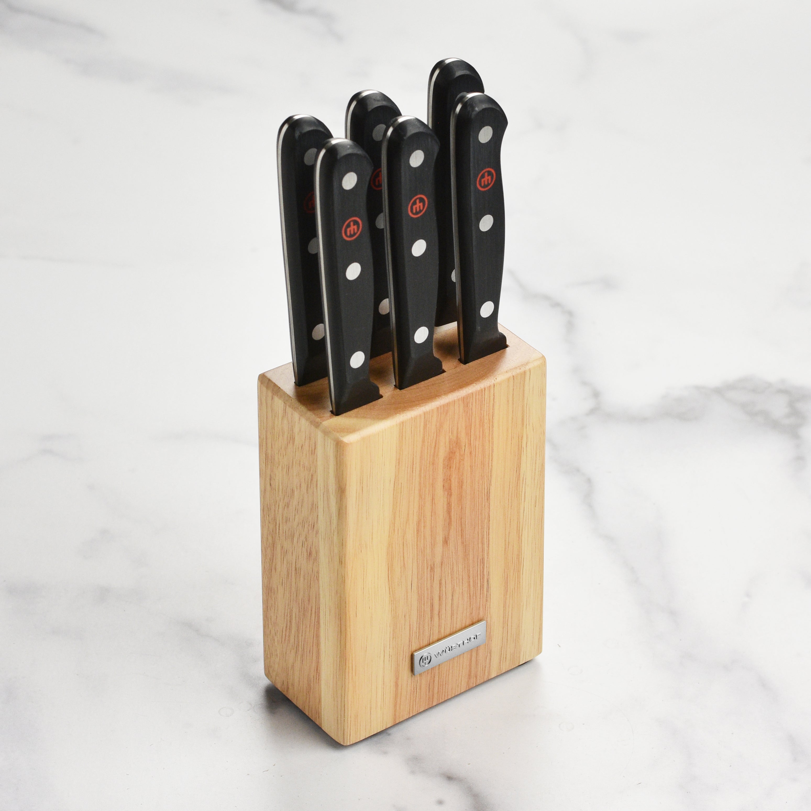 Wusthof steak knives in action, perfectly slicing through a juicy steak at a family dinner.