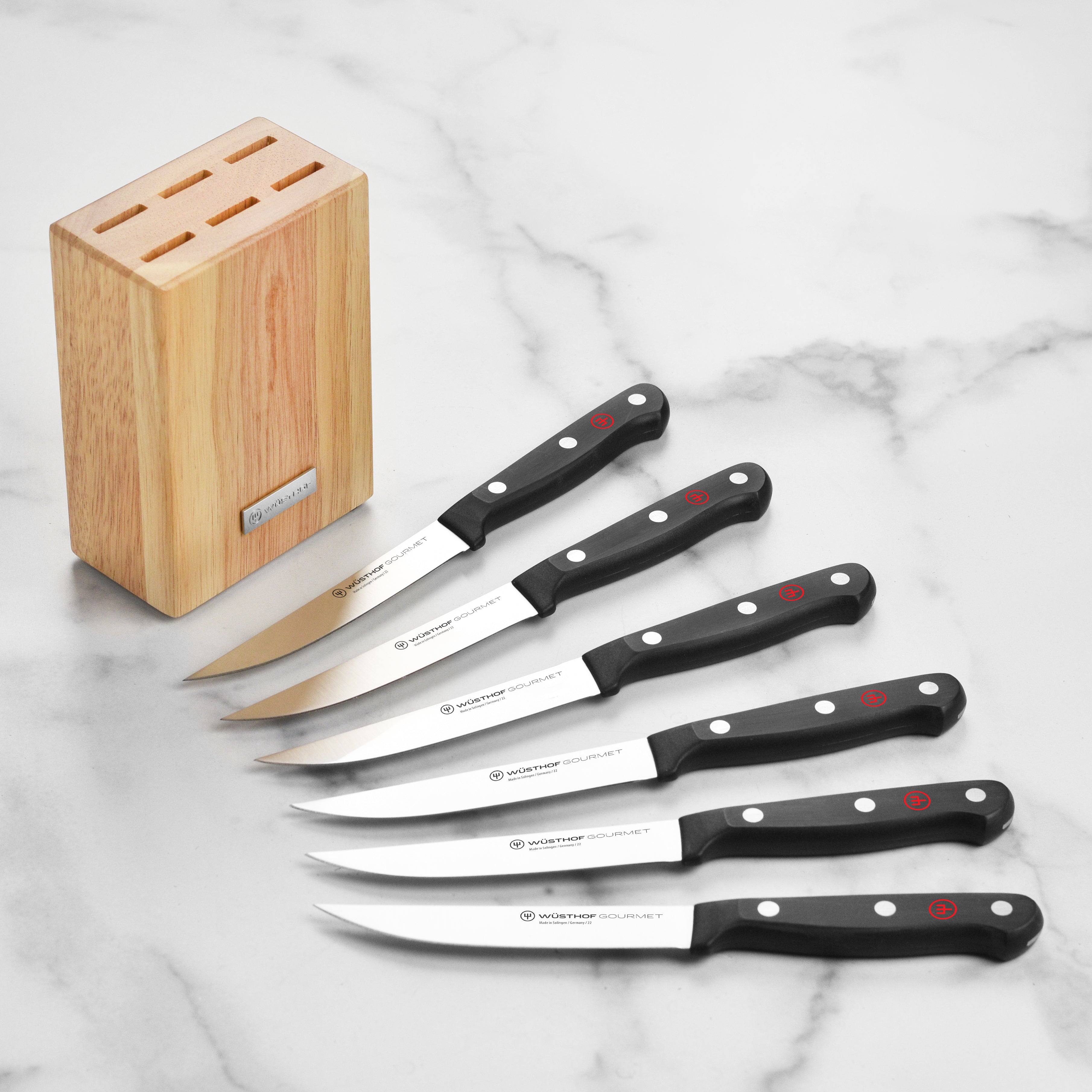 Wusthof steak knife set displayed in a wooden block, emphasizing its elegant design for kitchen cutlery.