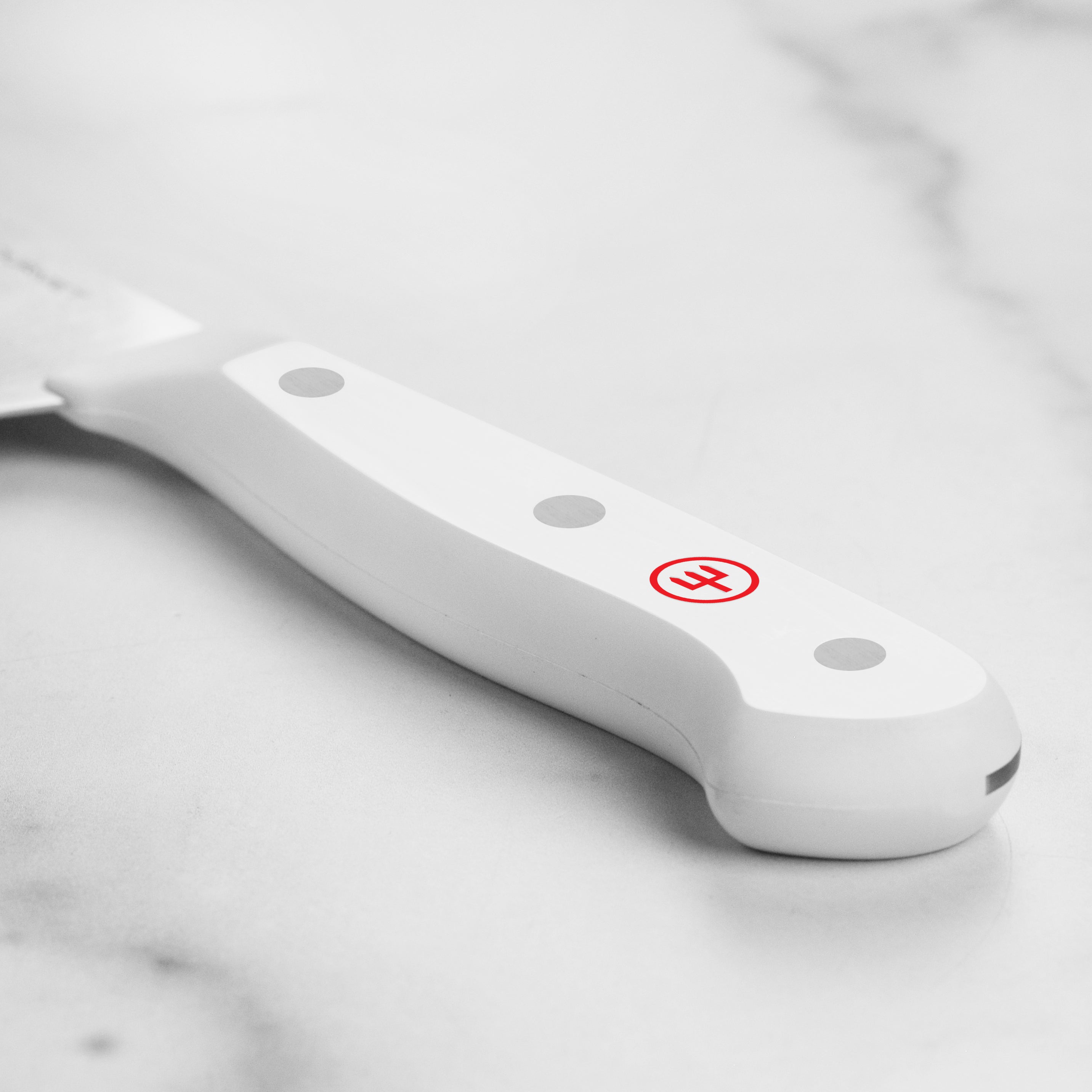 Close-up of the Wusthof Gourmet Santoku knife showcasing the precision blade.