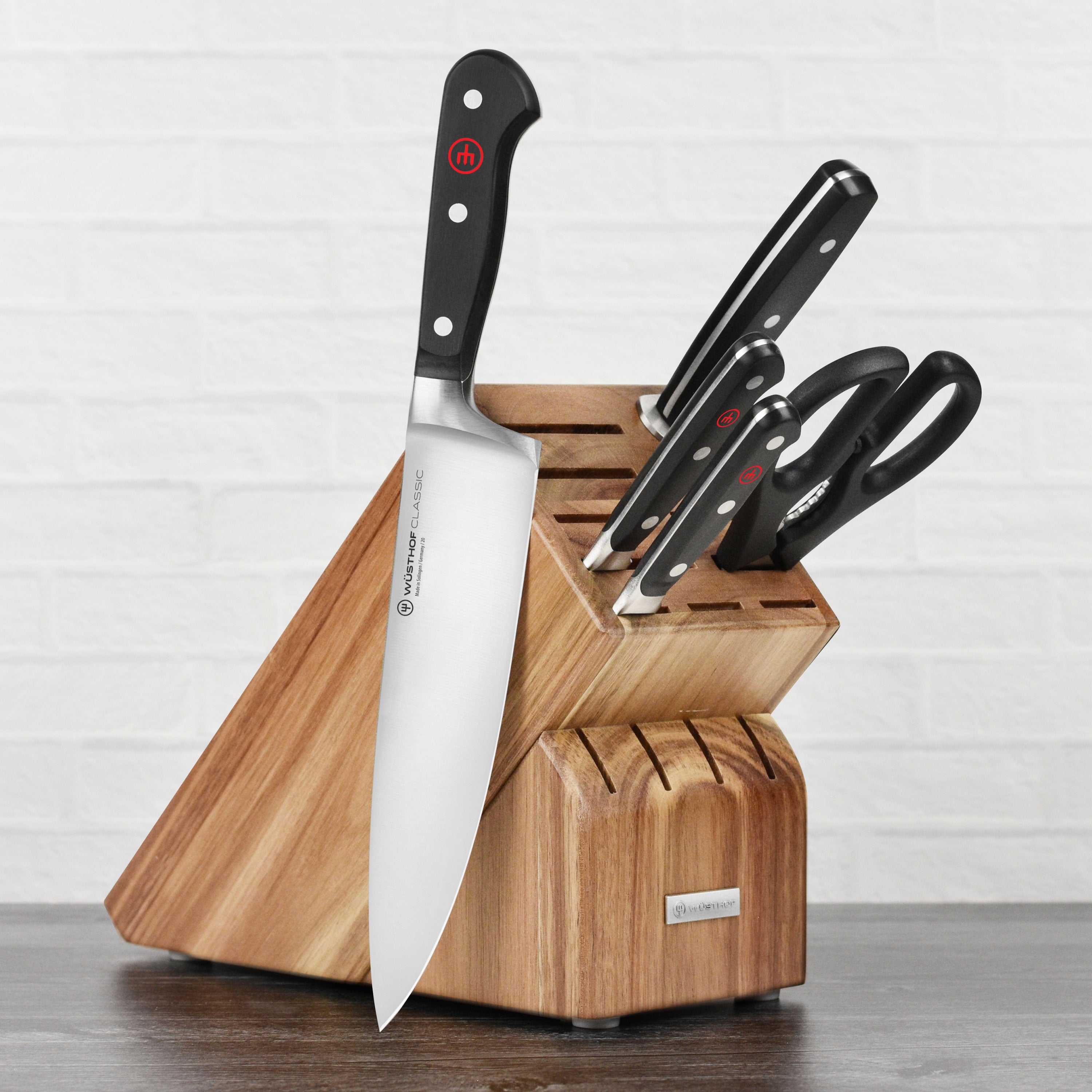 Close-up of Wusthof chef knife with high carbon steel blade in a kitchen setting