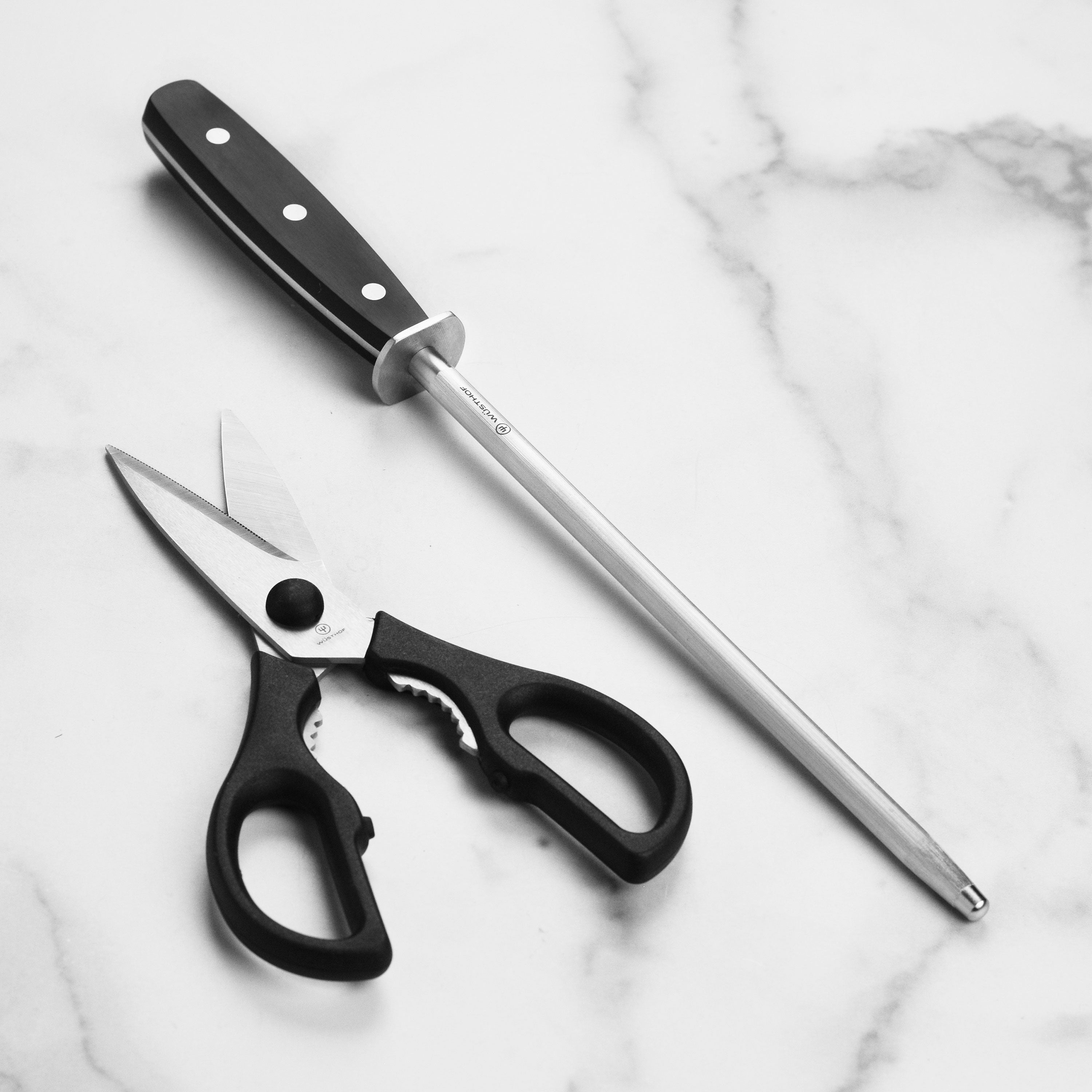 Detailed view of the handle and blade of a Wusthof kitchen knife for professional chefs