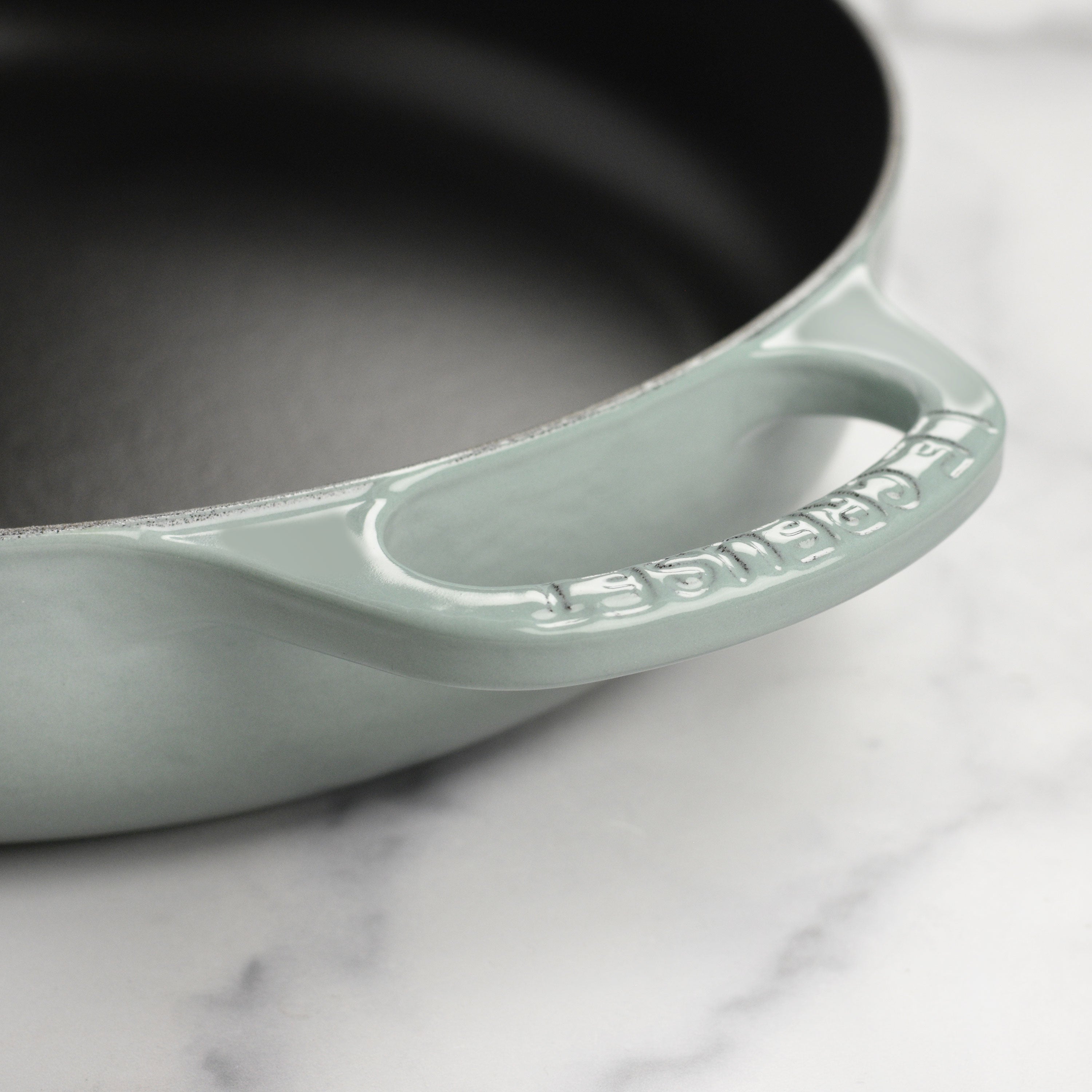 A beautifully presented dish served in the Le Creuset cast iron pan, highlighting its elegant design.