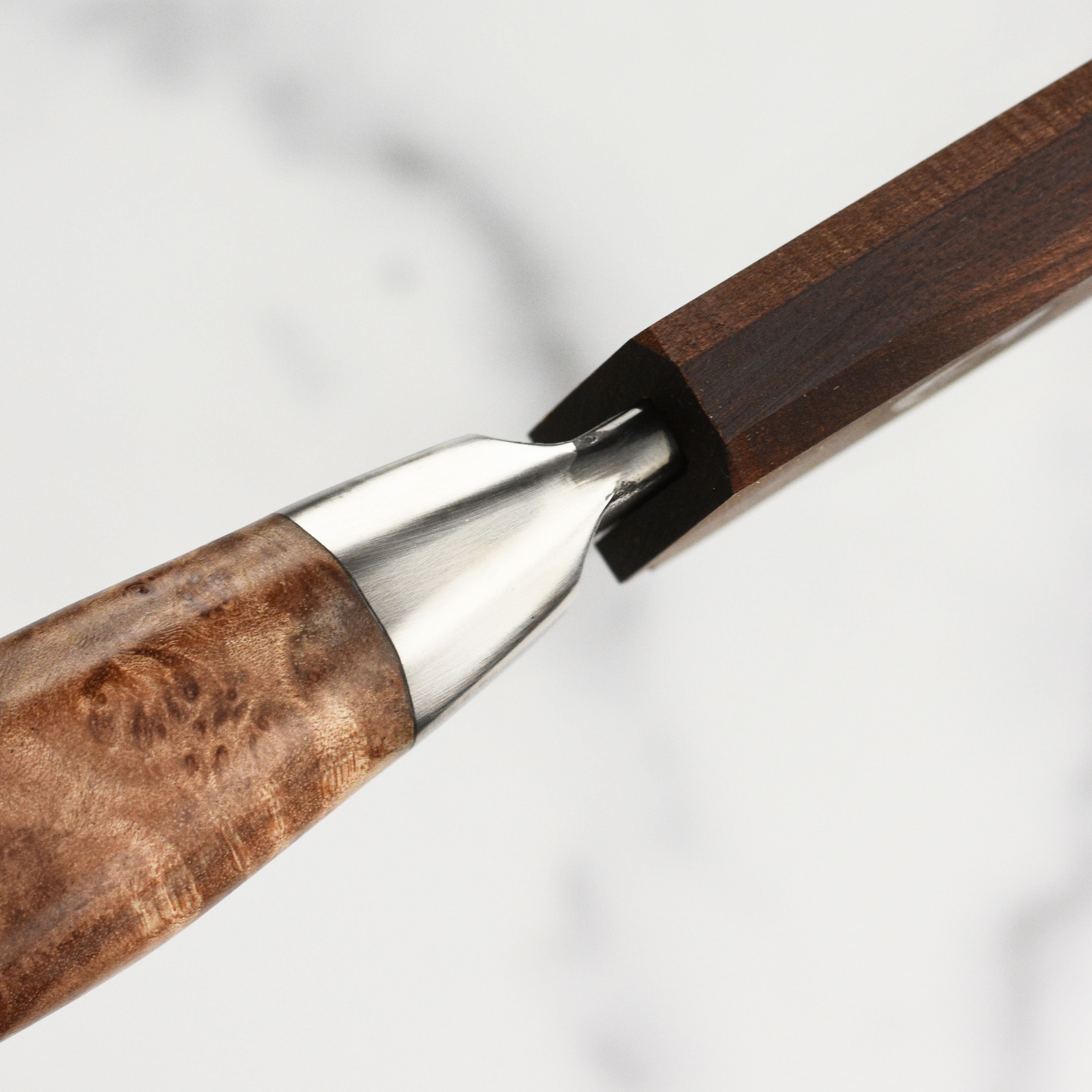 Elegant Oregon maple wooden magnetic knife sheath displayed on a kitchen countertop.
