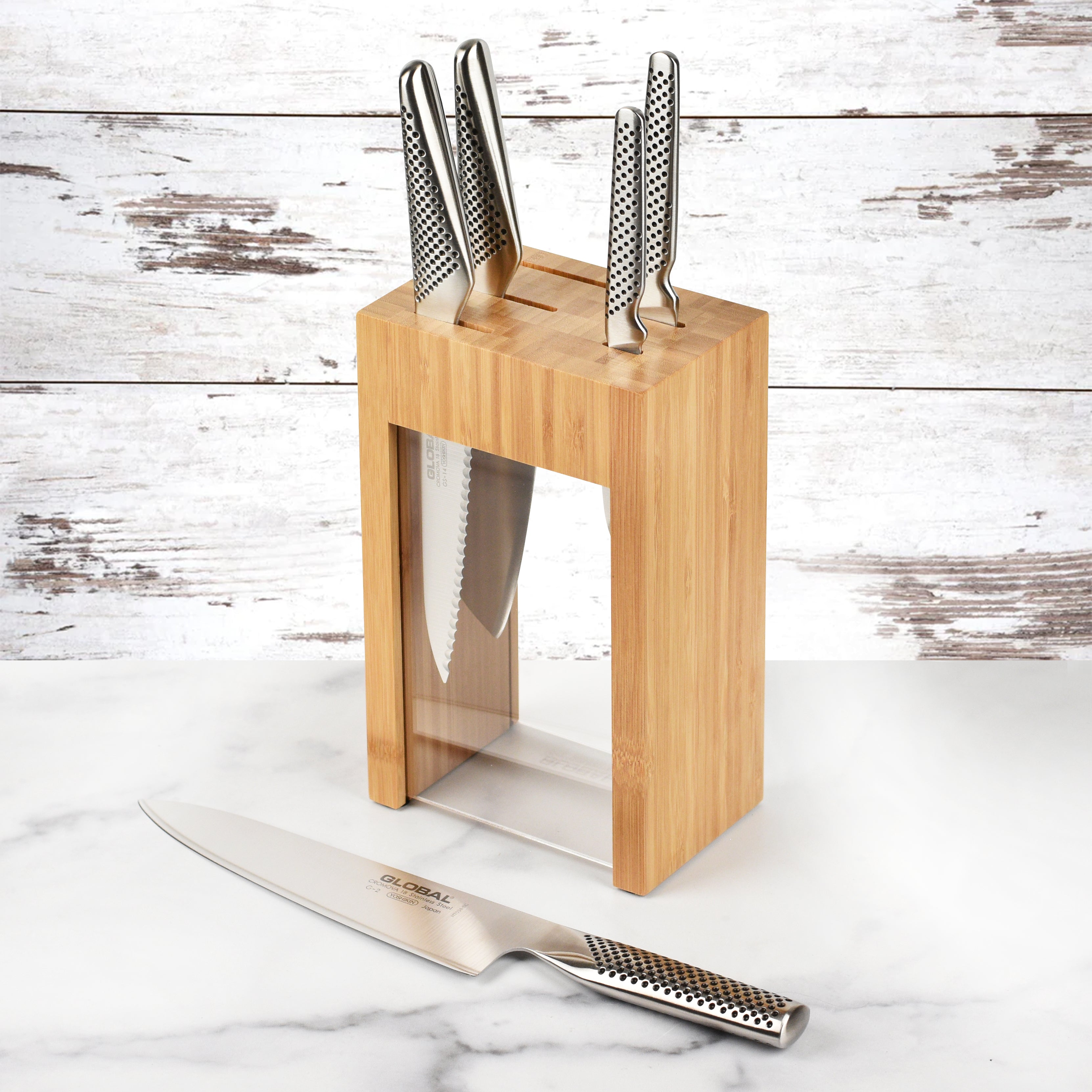 Global Osaka knife set in sleek wooden knife block showing high carbon kitchen knives