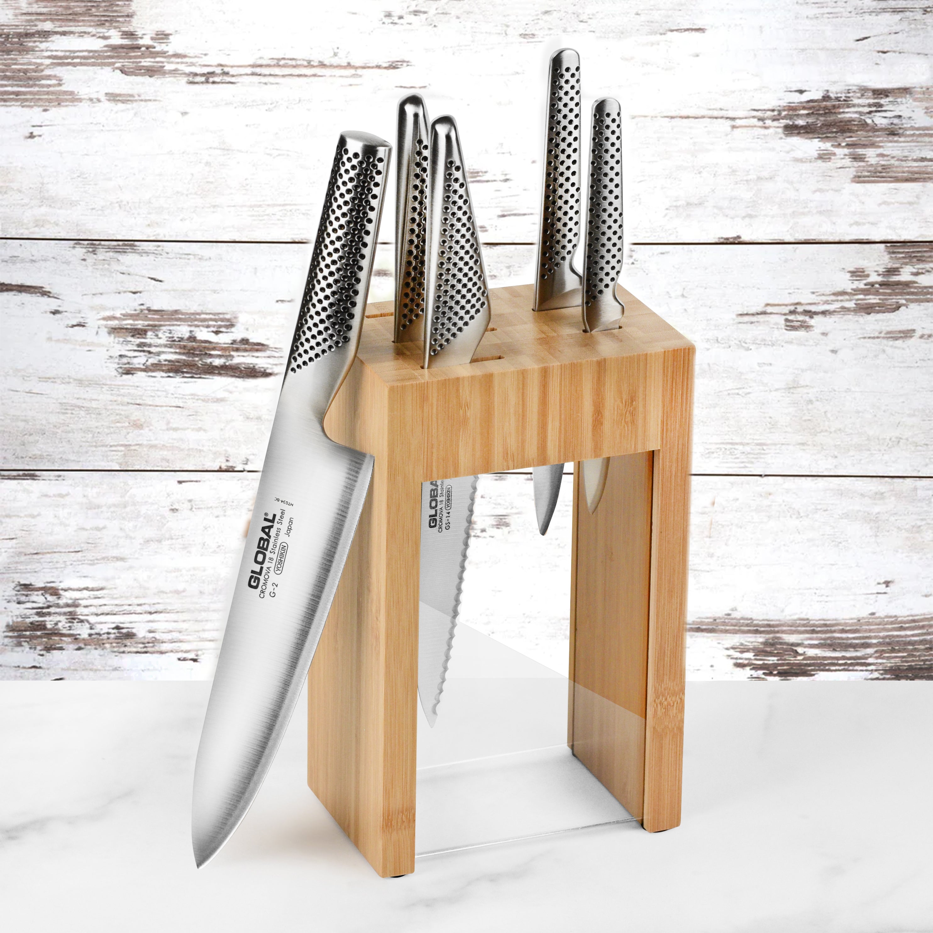 Global Osaka knife set in sleek wooden knife block showing high carbon kitchen knives