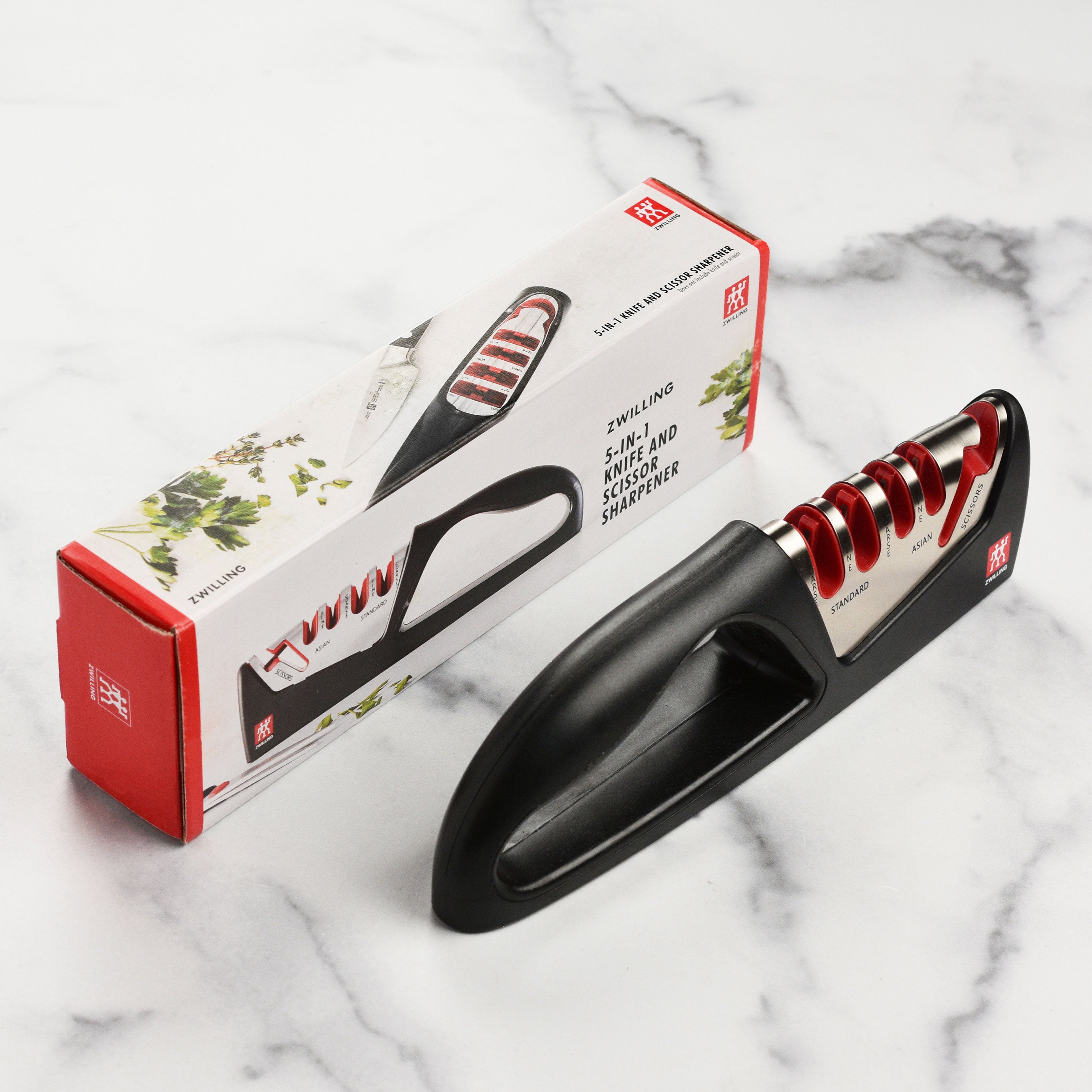 Using the kitchen sharpener to sharpen a Western chefs knife