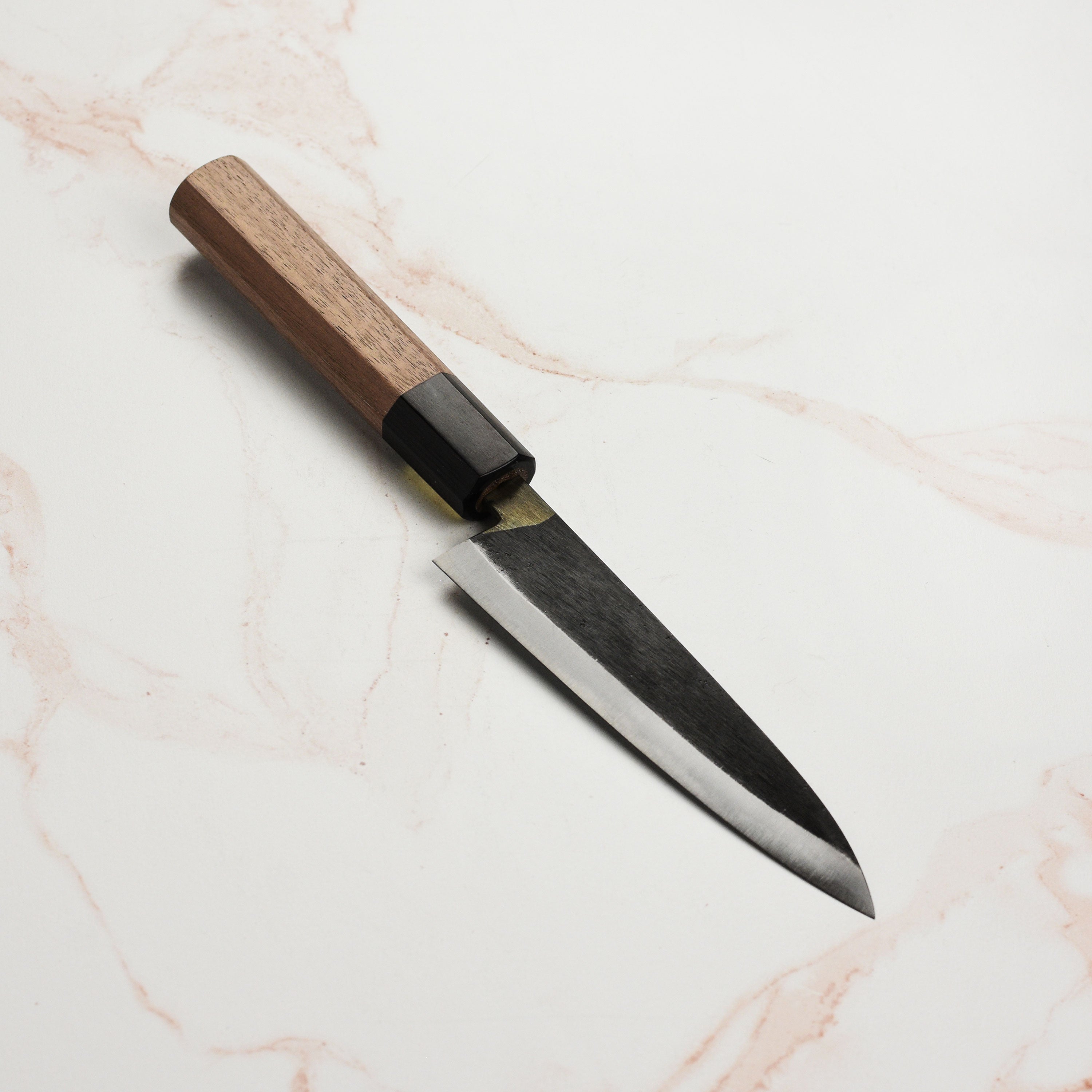 Chef slicing vegetables with the Moritaka Japanese petty knife