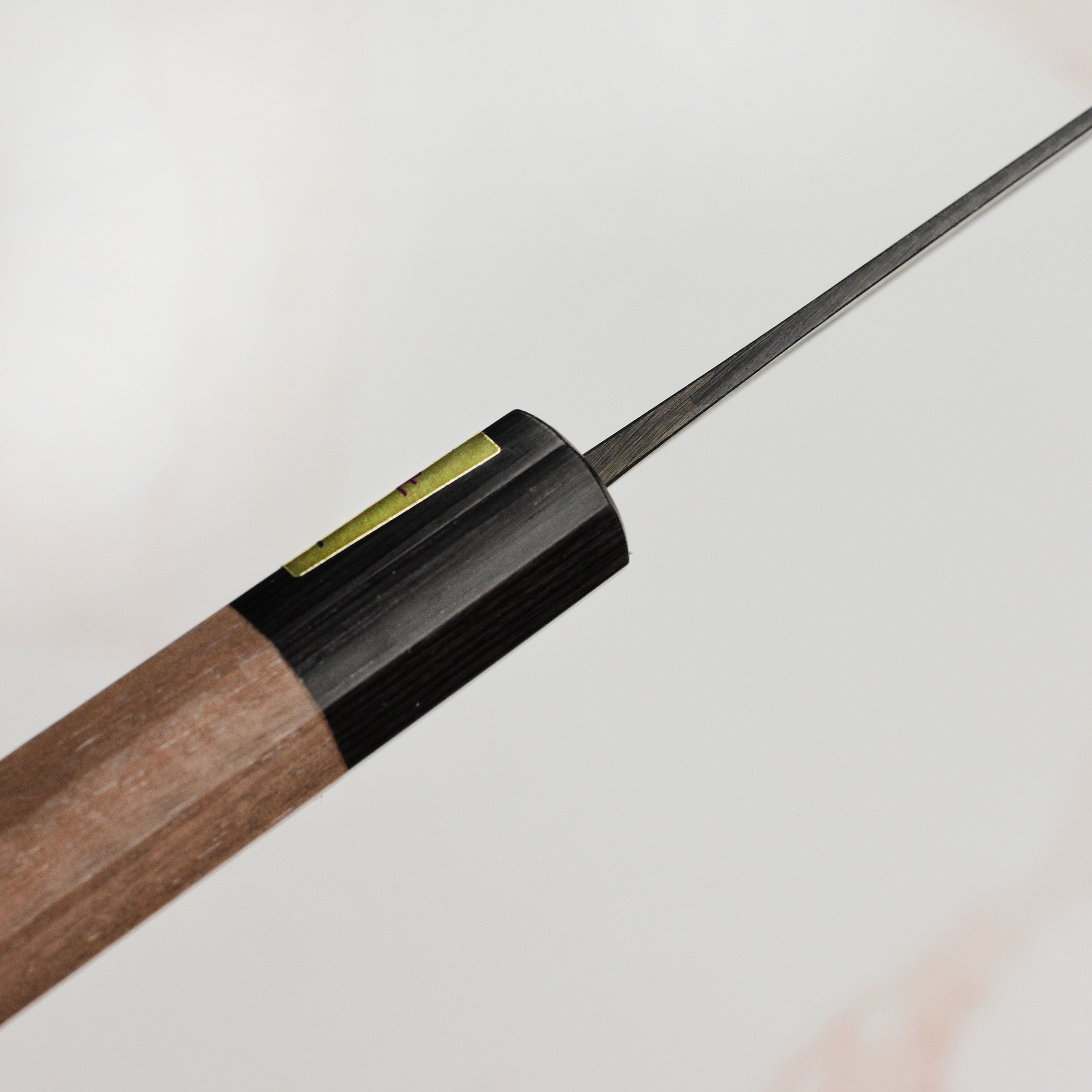 Close-up of the hand-forged blue steel blade and handle of the Moritaka petty knife