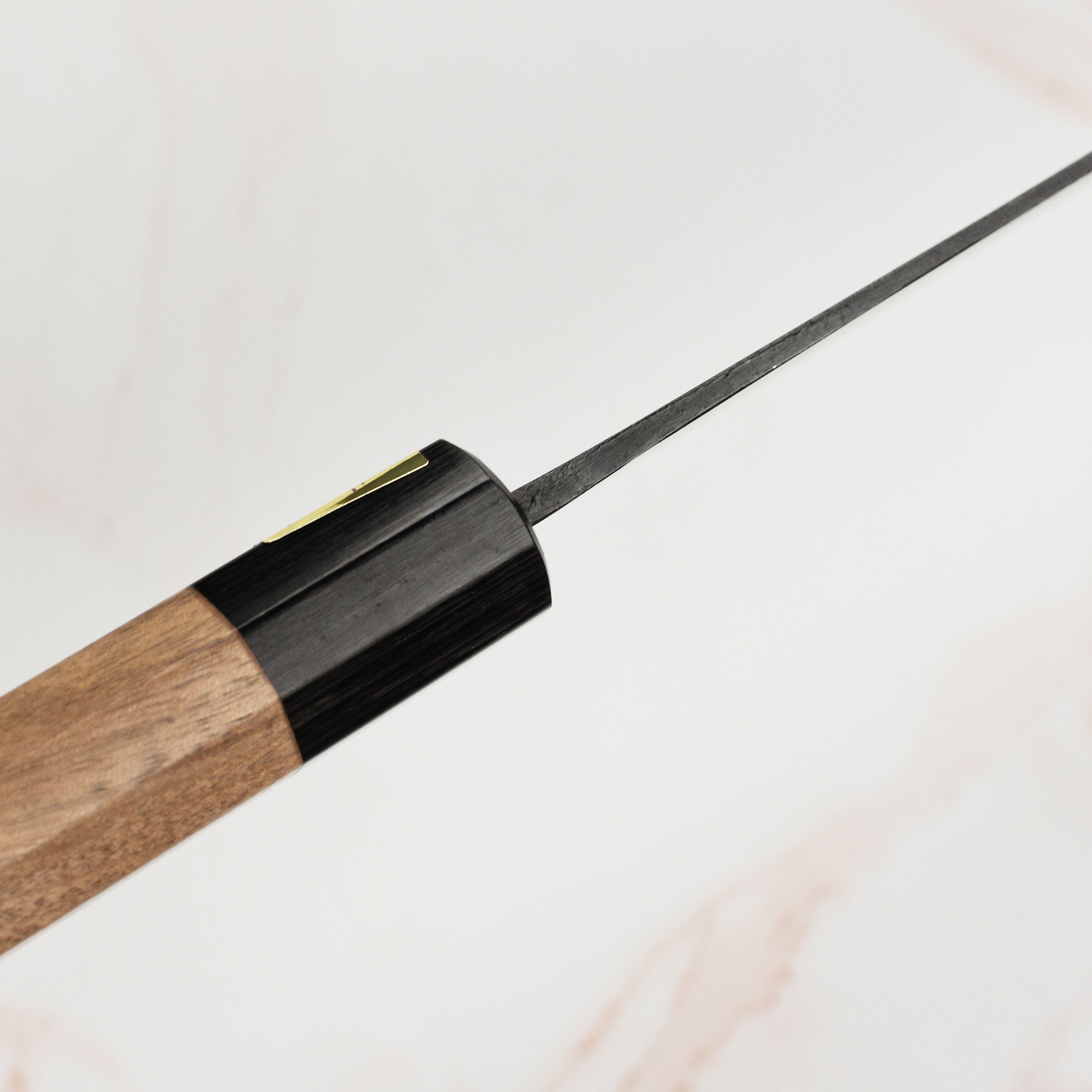 Elegant walnut handle of Moritaka chefs knife with pakkawood ferrule for comfortable grip