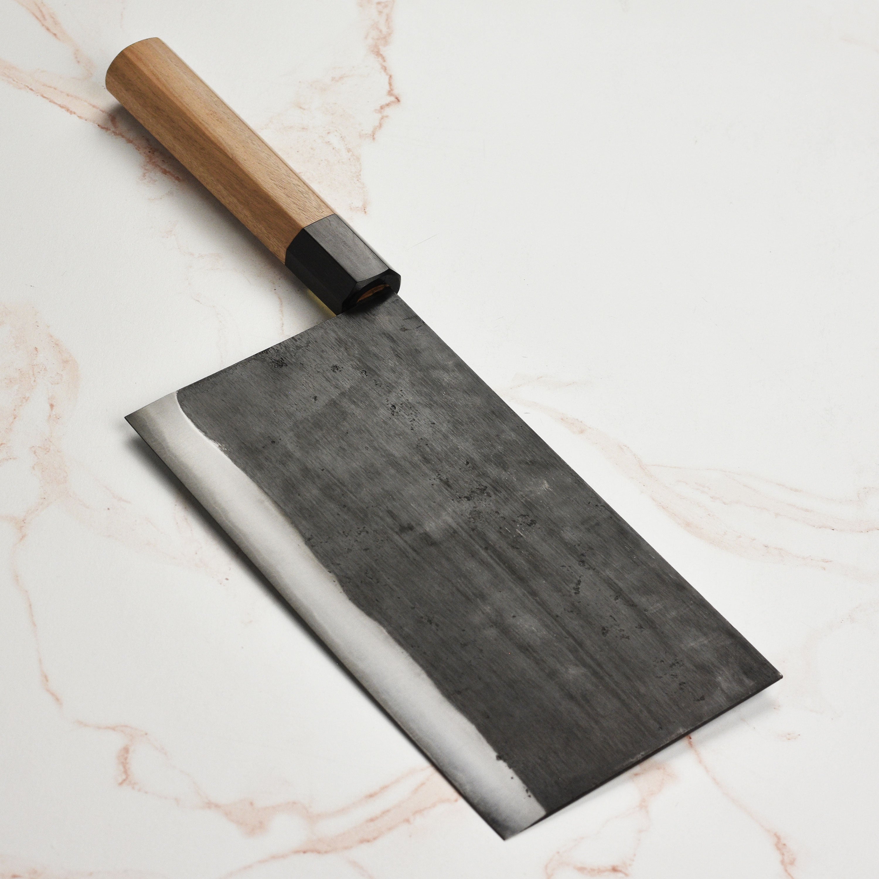 Chef using the Moritaka Aogami super knife to chop vegetables in a professional kitchen setting.