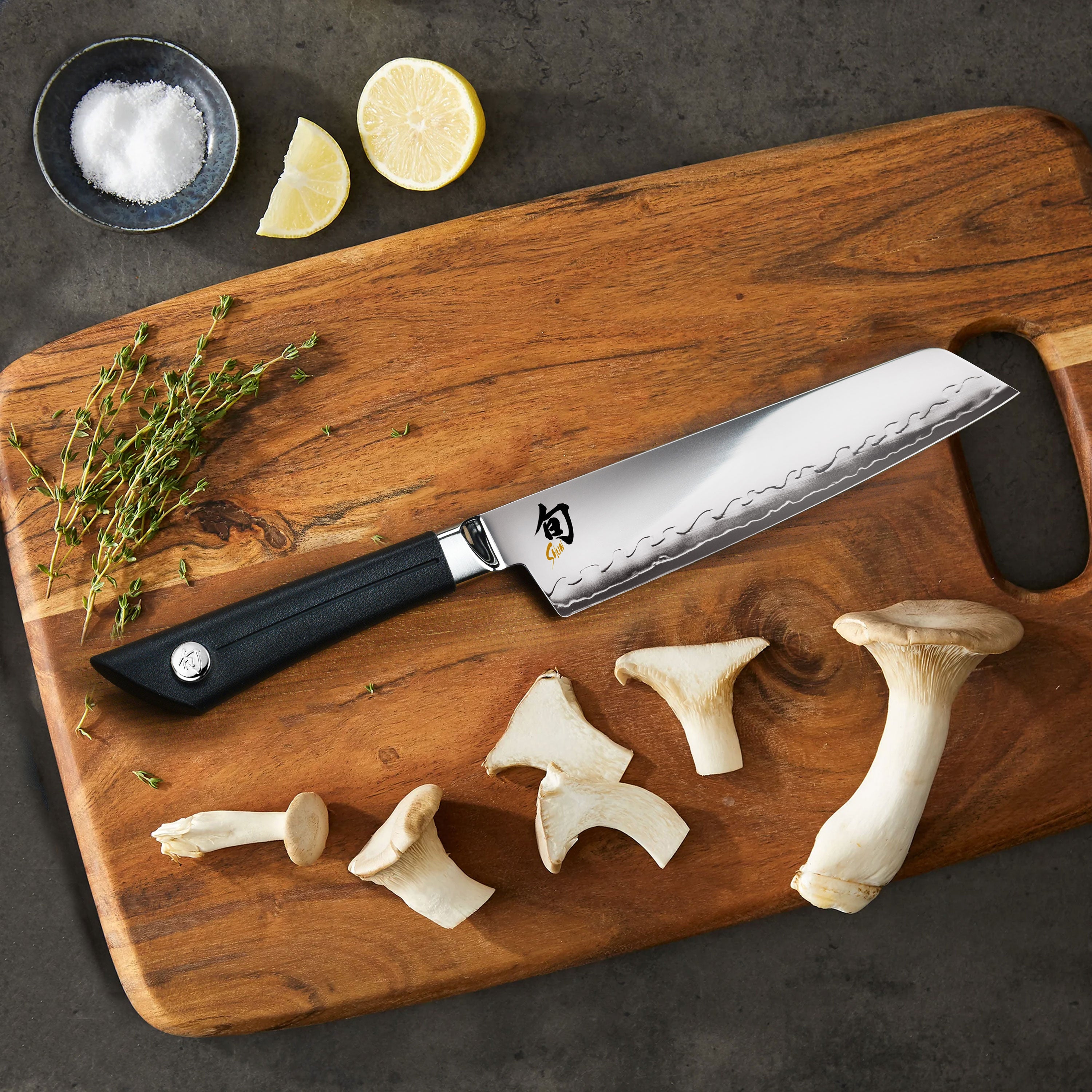 Sora Master Utility Knife in action, slicing through fresh vegetables.