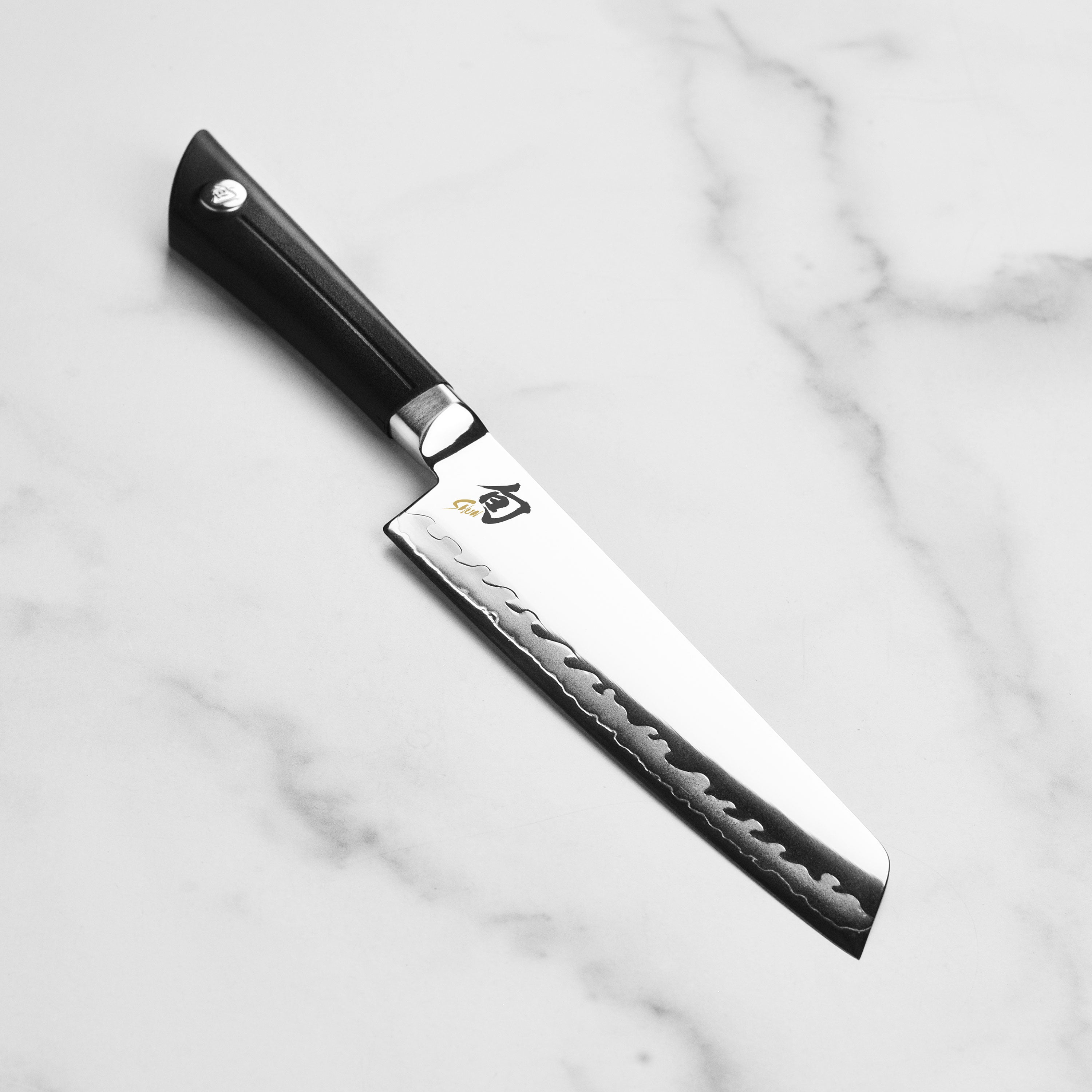 Close-up of the Sora Master Japanese Utility Knife highlighting the double-bevel blade.