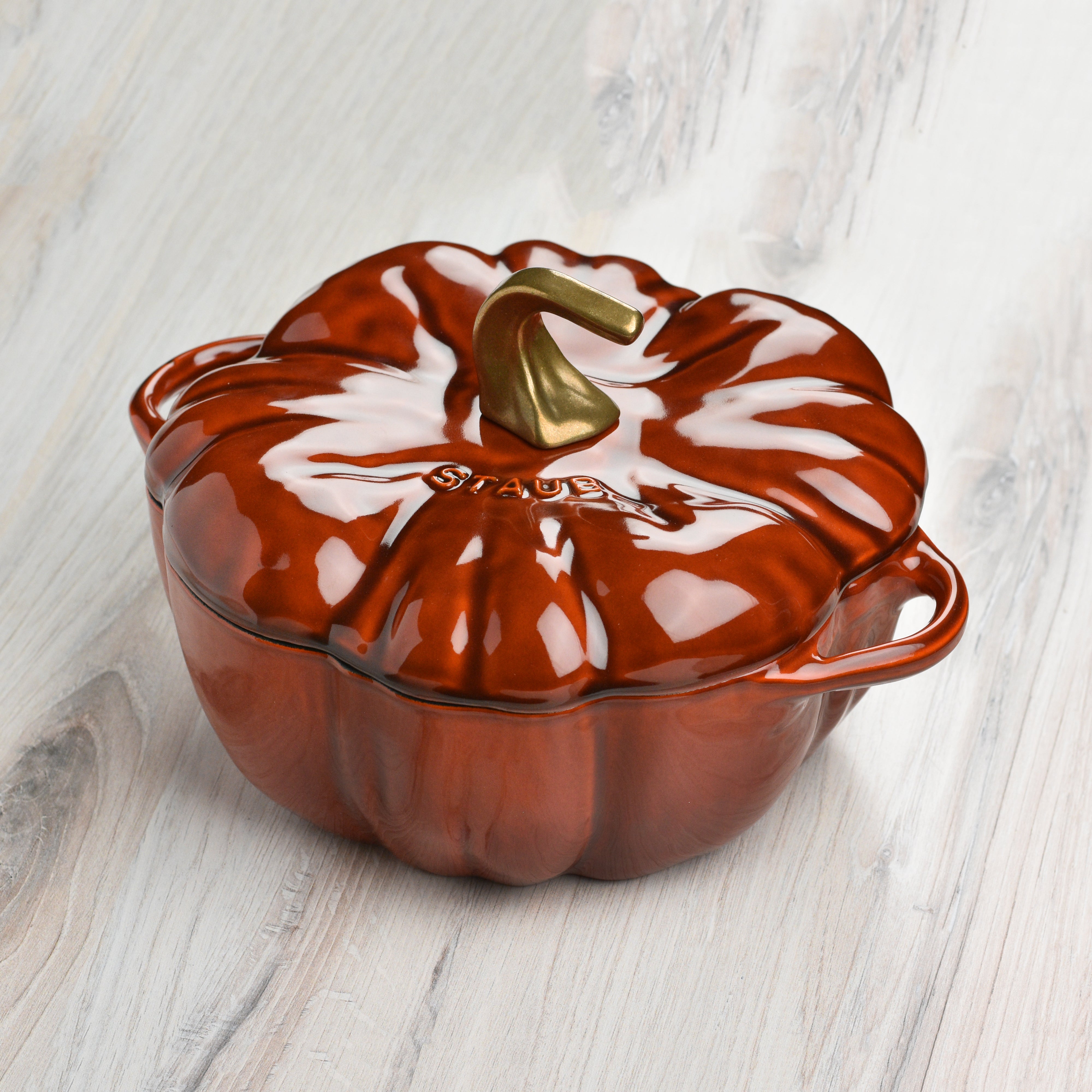 Top view of the burnt orange cast iron cocotte showcasing its unique pumpkin shape.