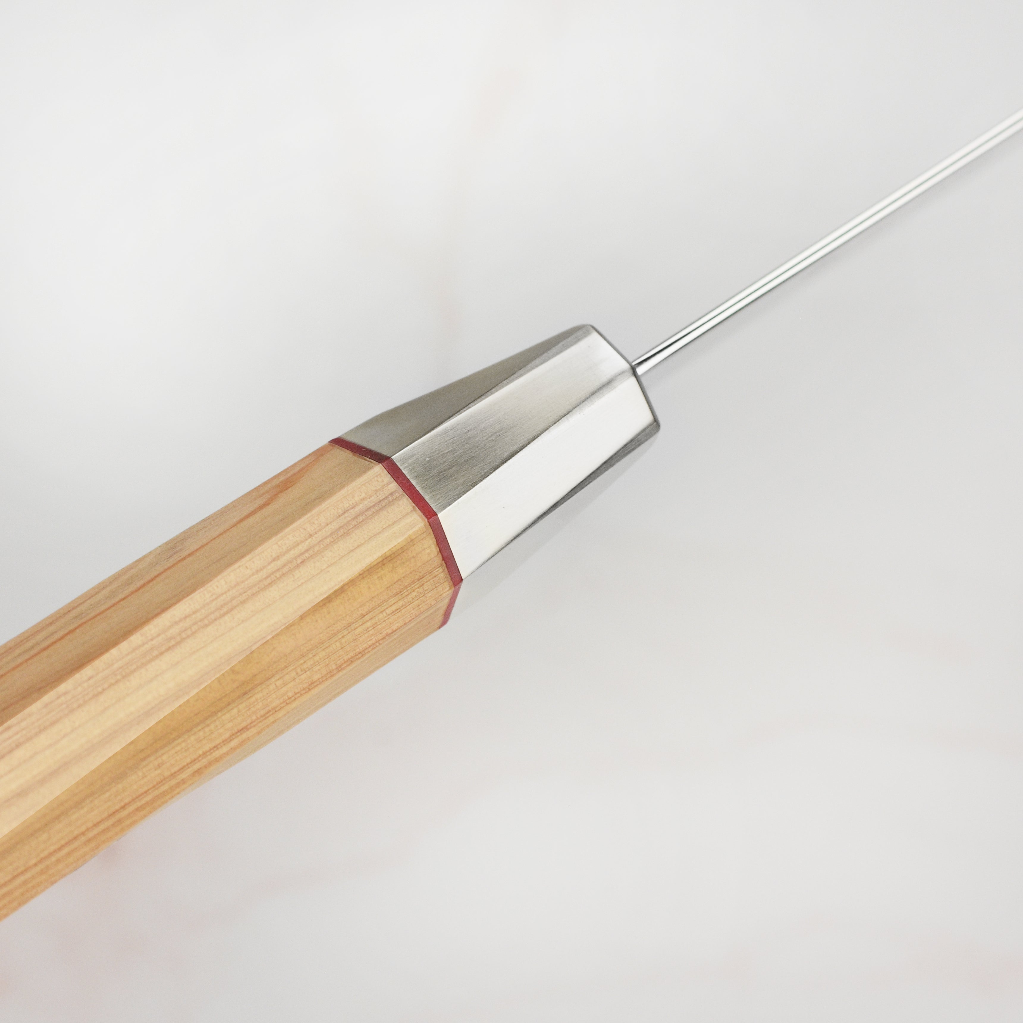 Side view of the Aogami Steel Master Gyuto knife demonstrating its sharp edge and elegant design.