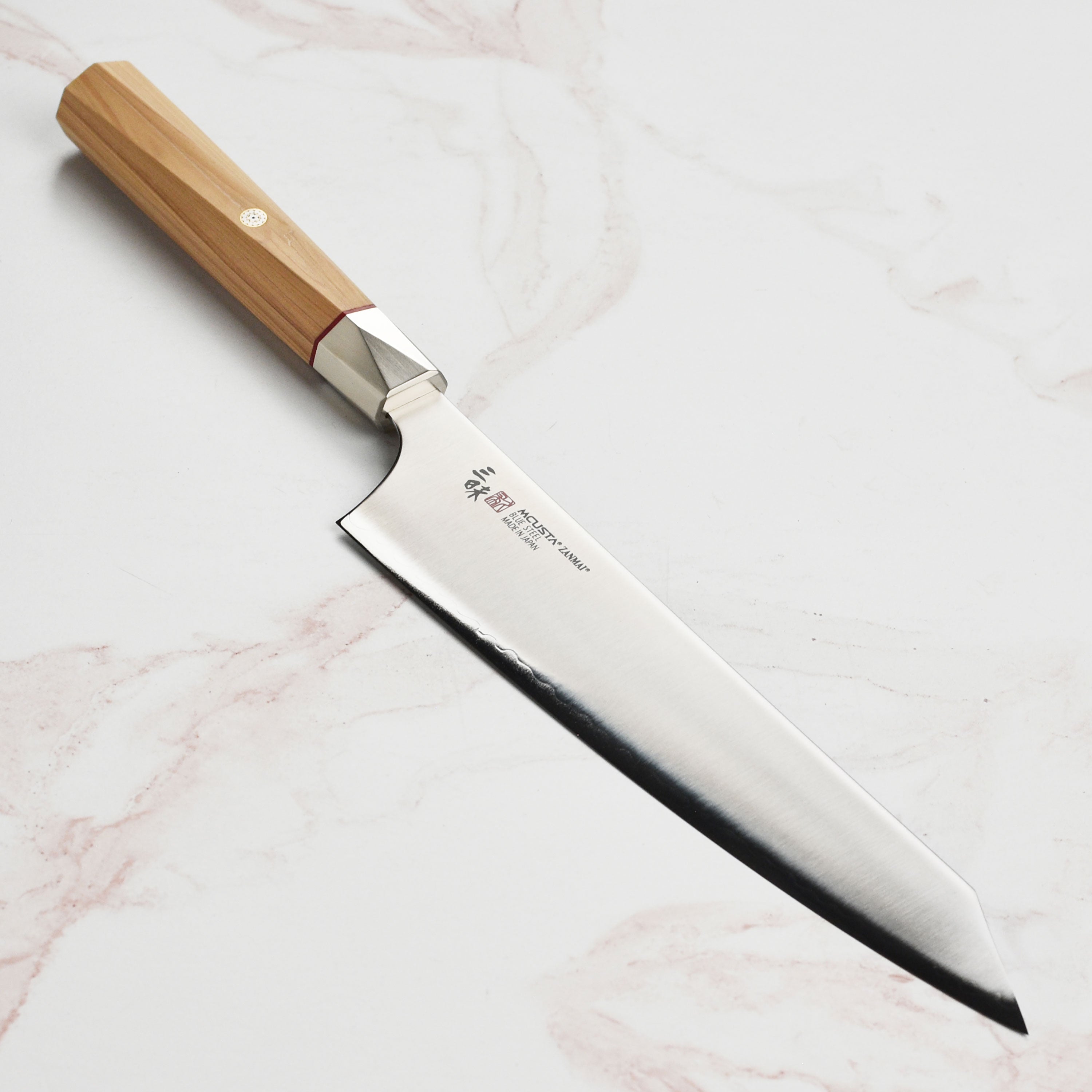 Close-up view of the Aogami Super 9.4-Inch Gyuto knife blade and edge.