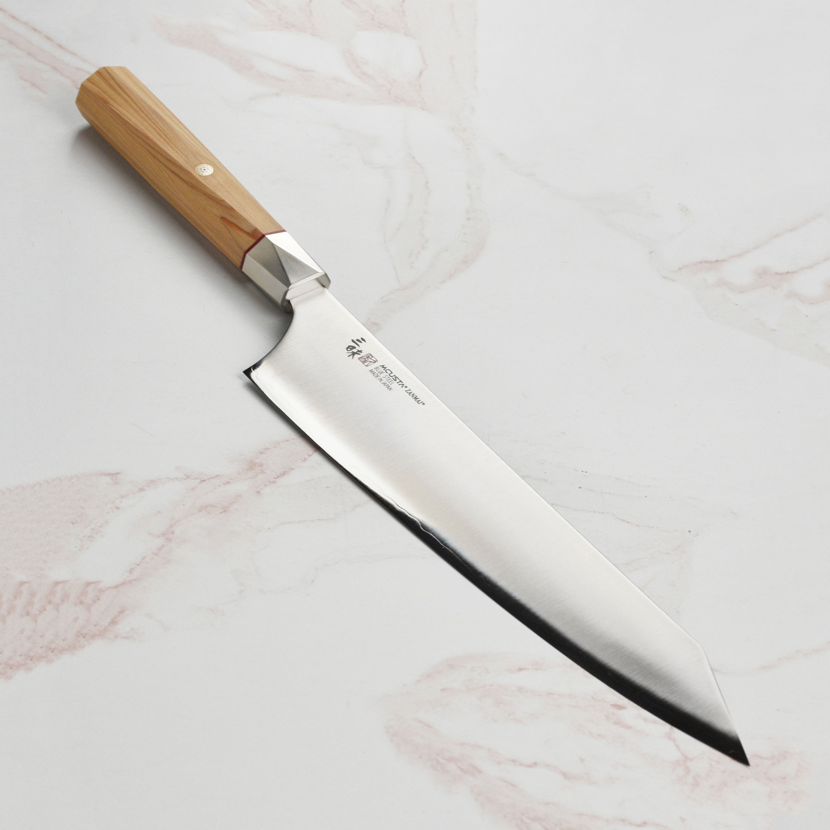 Aogami Steel Master Gyuto knife with twisted octagonal Hinoki wood handle, perfect for home cooking.