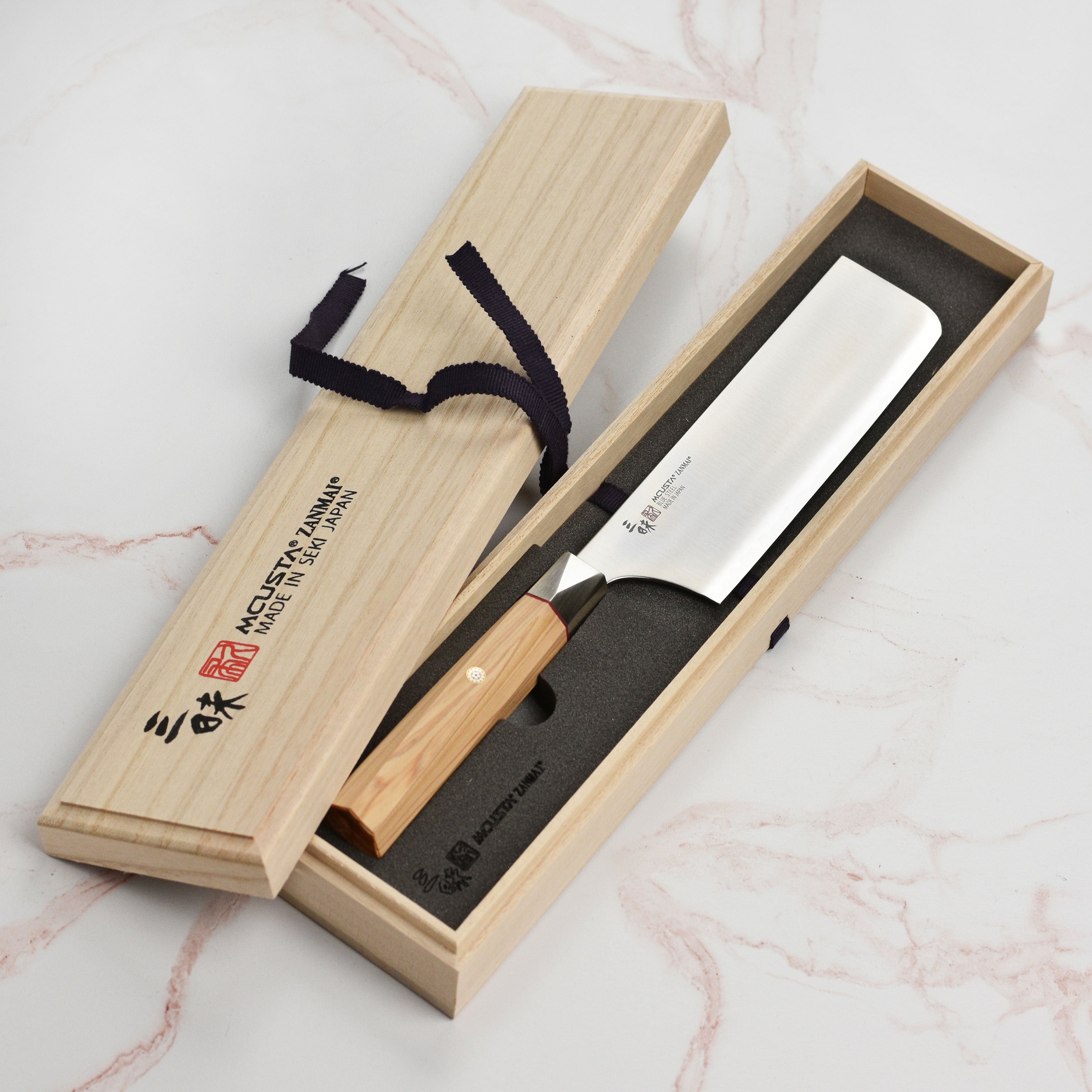 Handcrafted Seki City knife with contour bolster and mosaic pin design