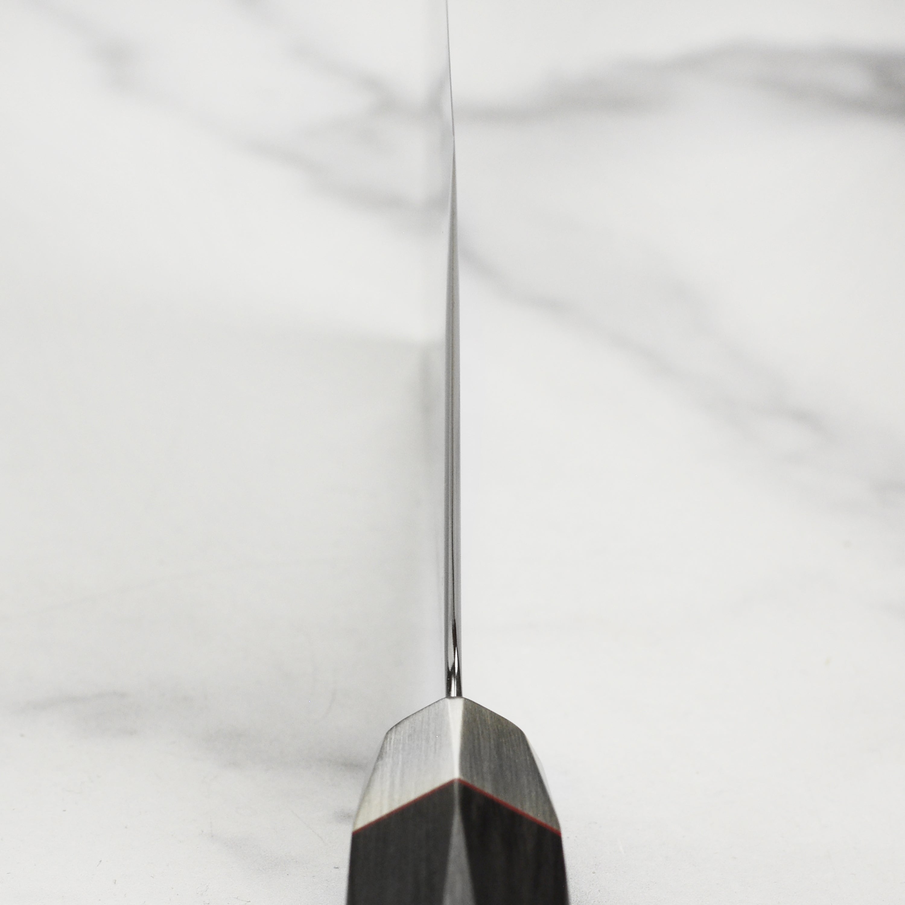 Close-up of the Damascus layered blade of the Japanese chef knife with VG10 steel
