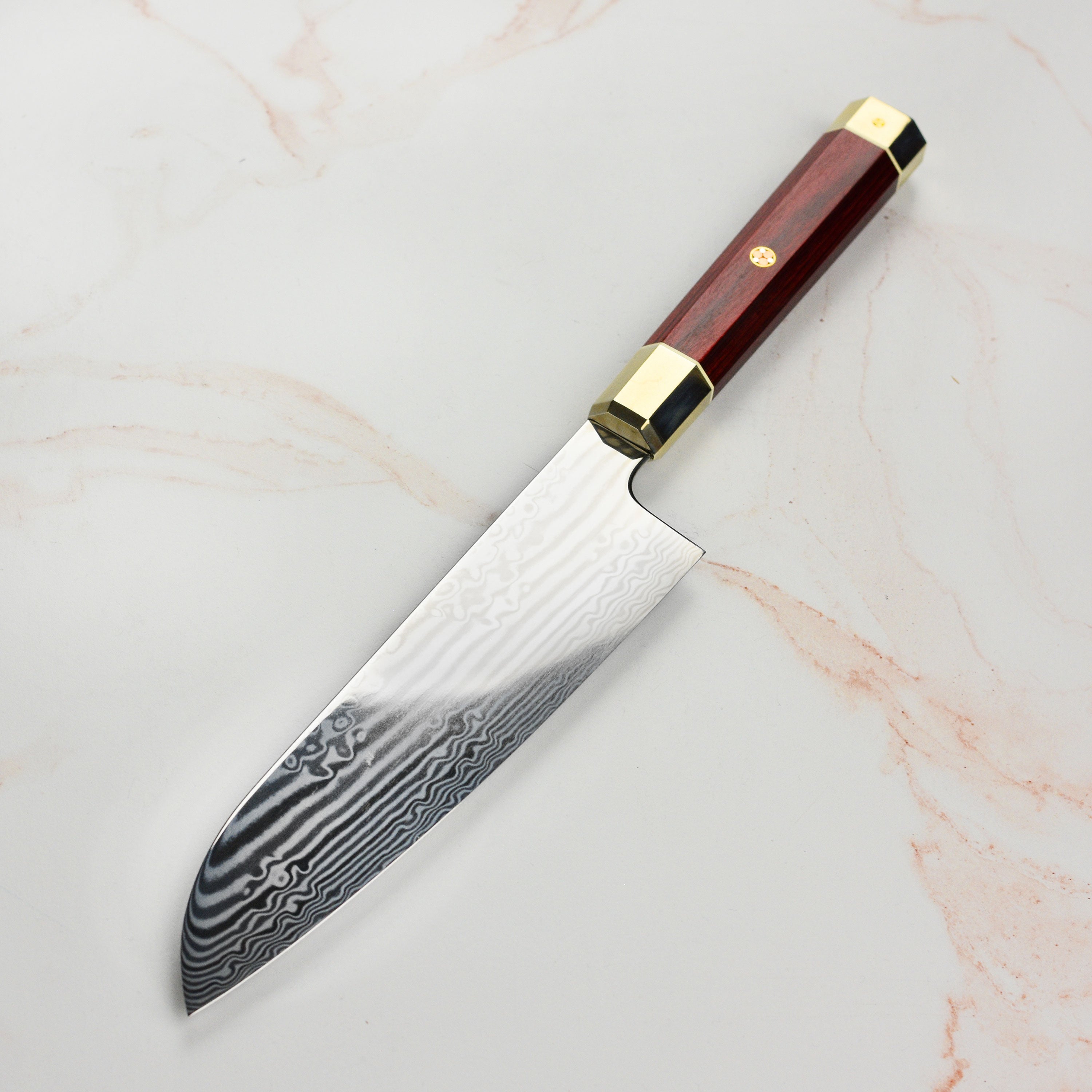 Ergonomic red Pakkawood handle of Zanmai chef knife for comfortable grip