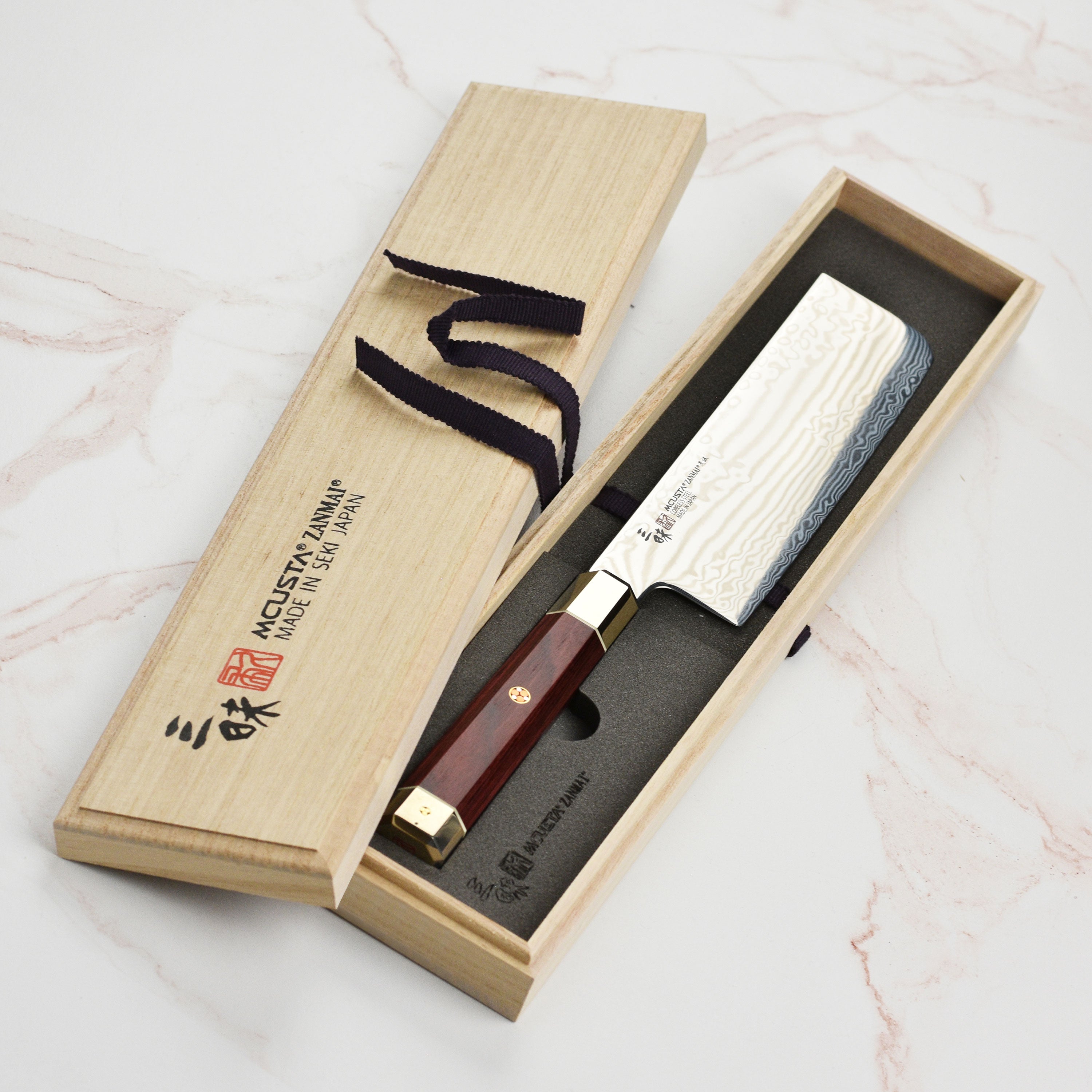 Handcrafted Japanese Nakiri knife displayed on a cutting board, ready for use