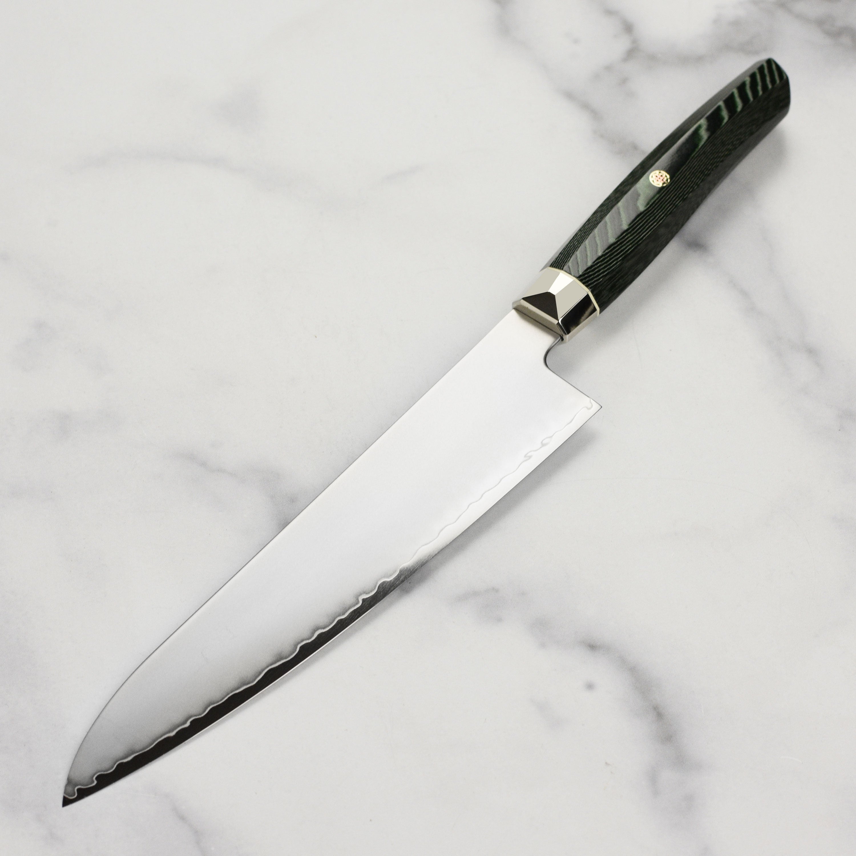 Close-up of the SG2 powder steel blade, highlighting its sharpness and craftsmanship.