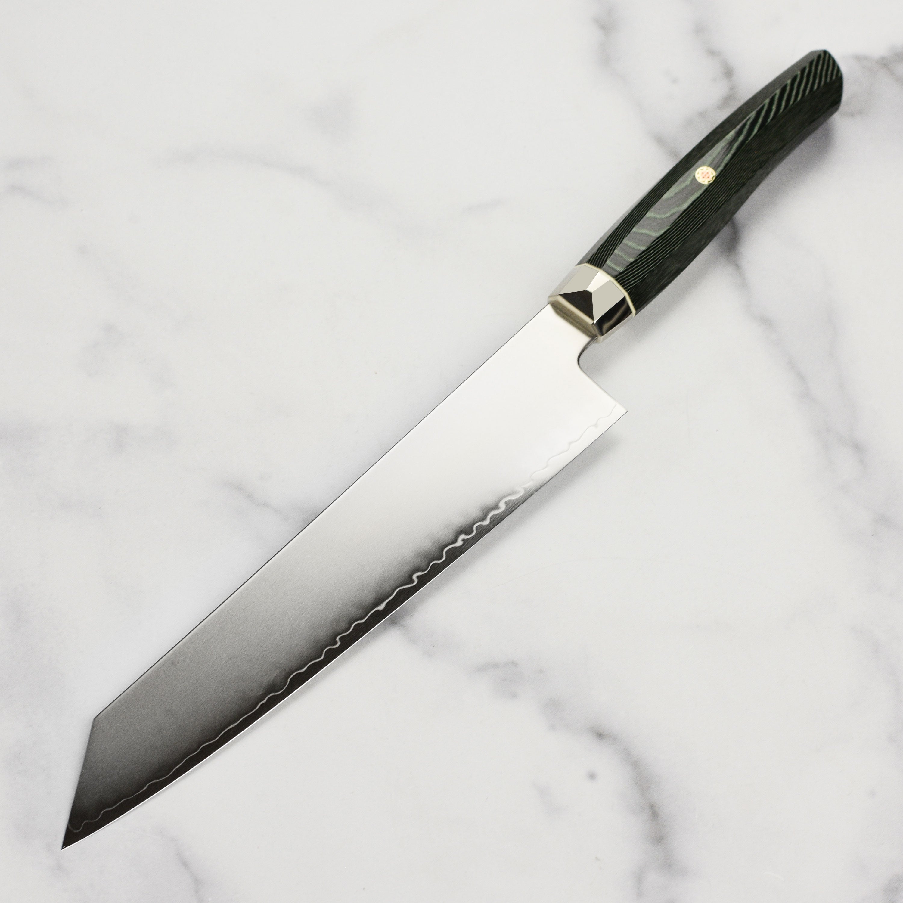 Top angle of the Japanese kitchen knife showing green Micarta handle and mosaic pin design