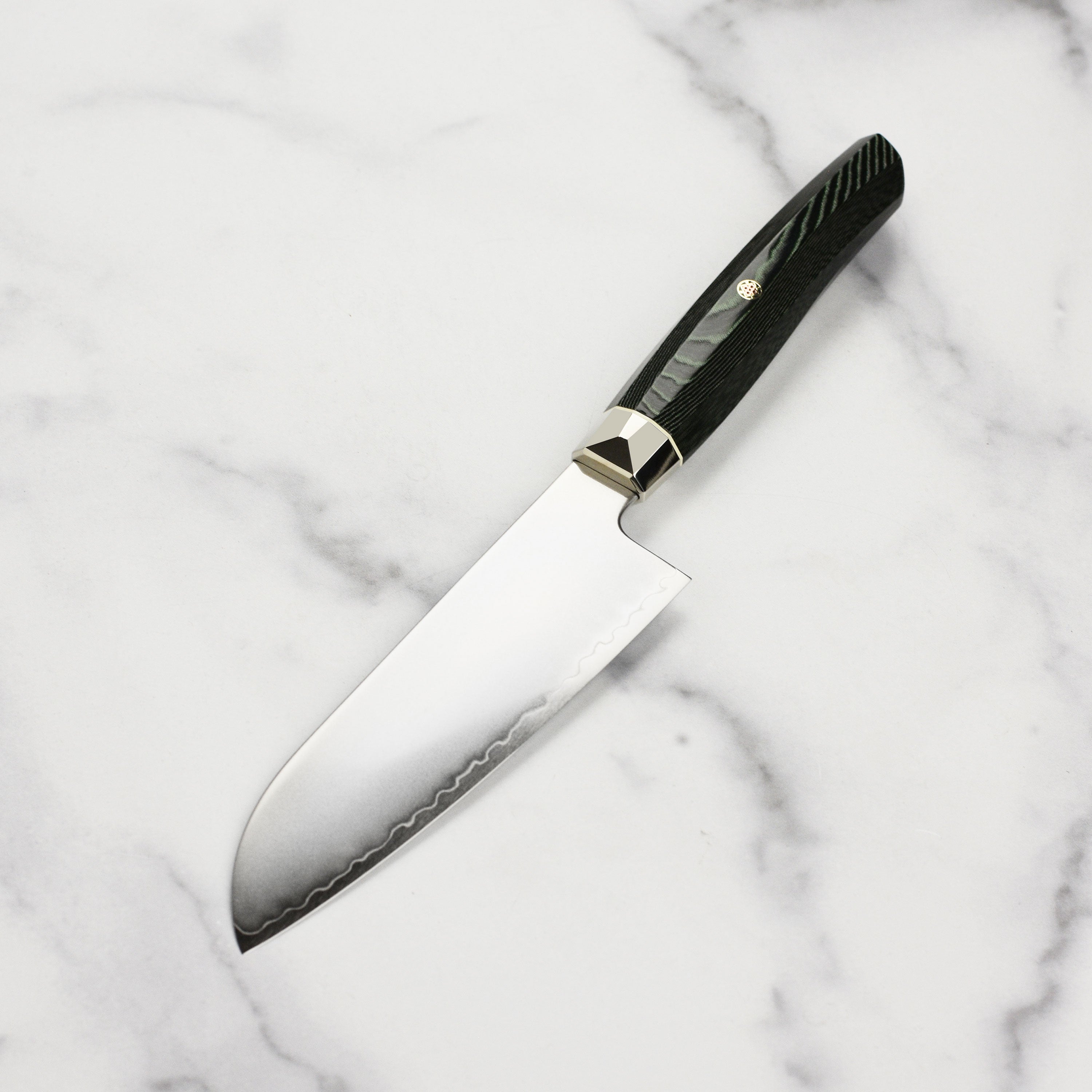 Side profile view of Santoku knife with green Micarta handle, highlighting the mosaic pin and ergonomic grip.