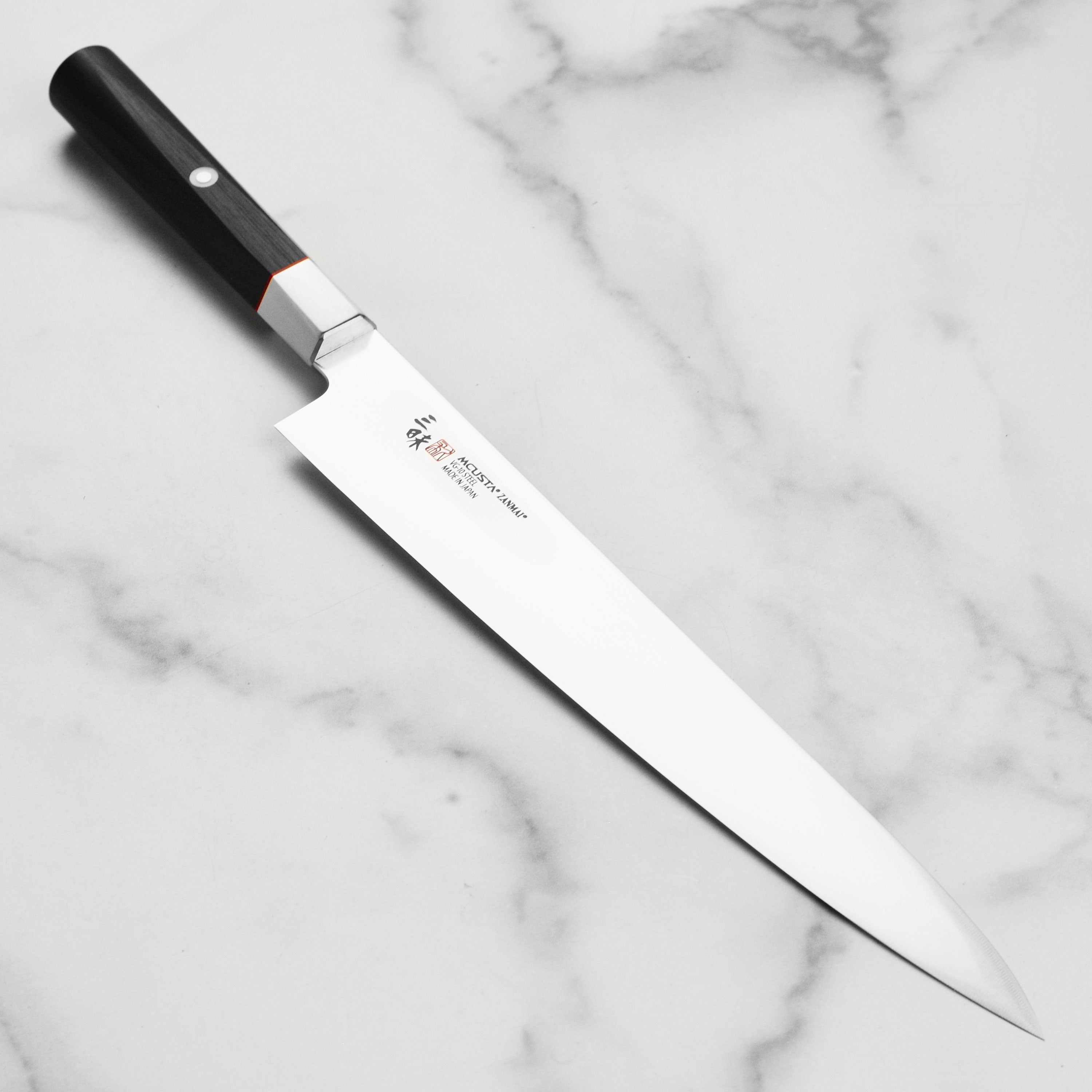 Close-up of SekiPro VG10 Sujihiki knife blade showing sharp edge and craftsmanship