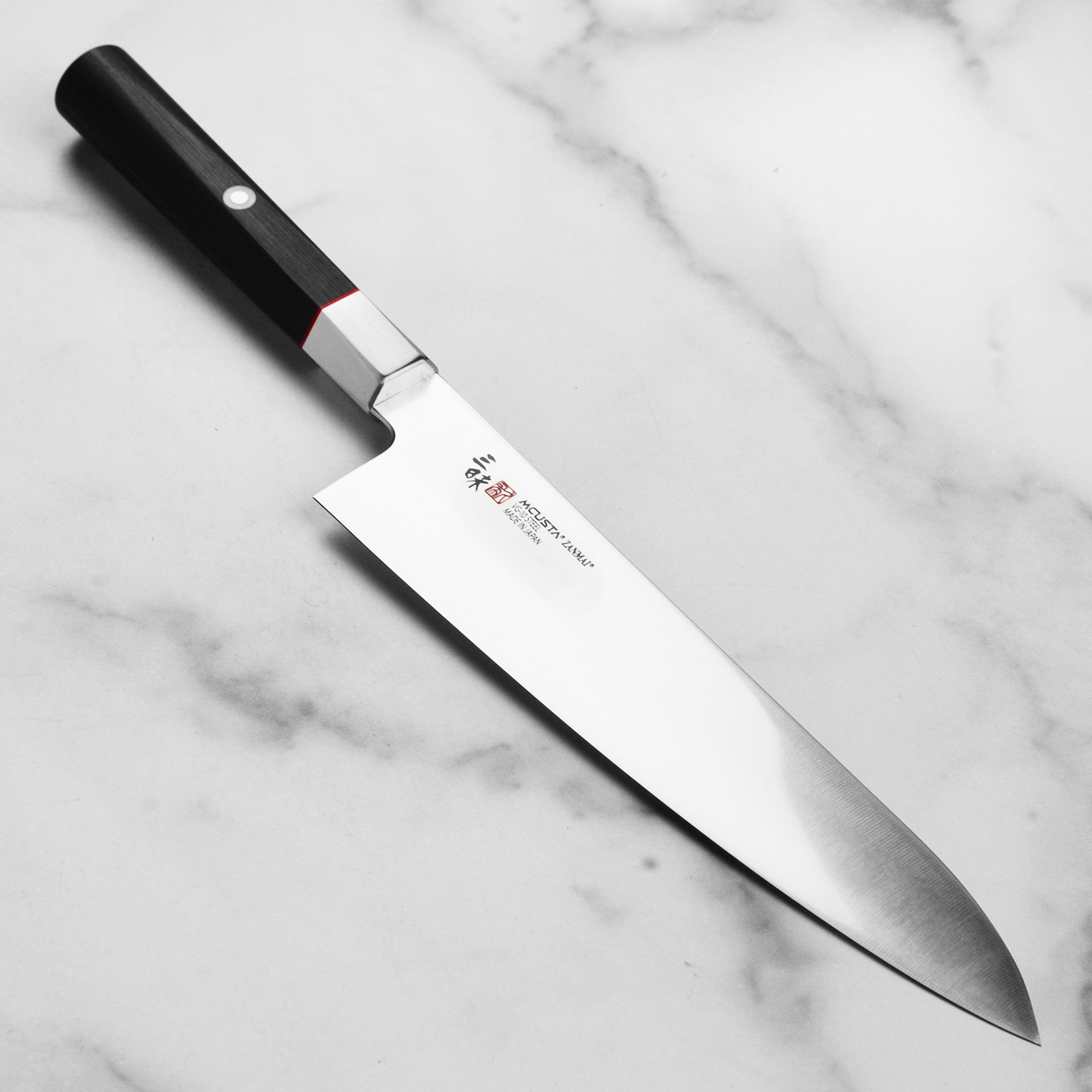 Seki City Hybrid VG10 Chef's Gyuto Knife at an angle showcasing the blade's sharpness