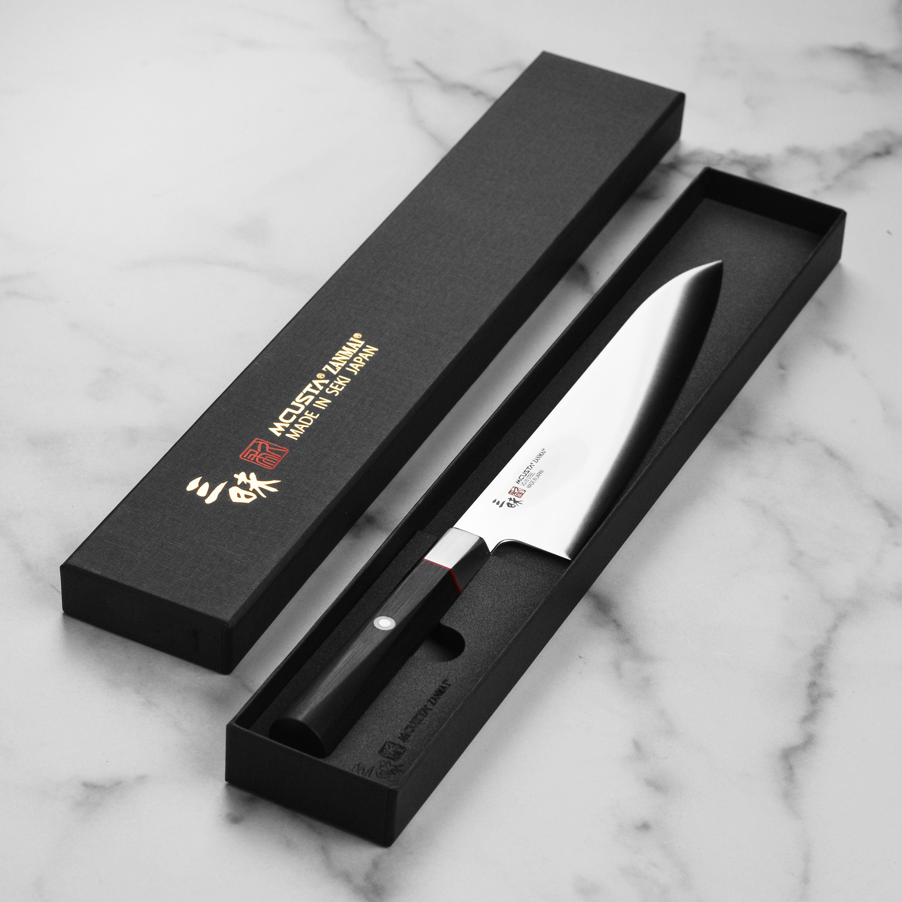 Close-up of the contour bolster of the Seki City Hybrid VG10 Chefs Knife highlighting its anti-bacterial properties