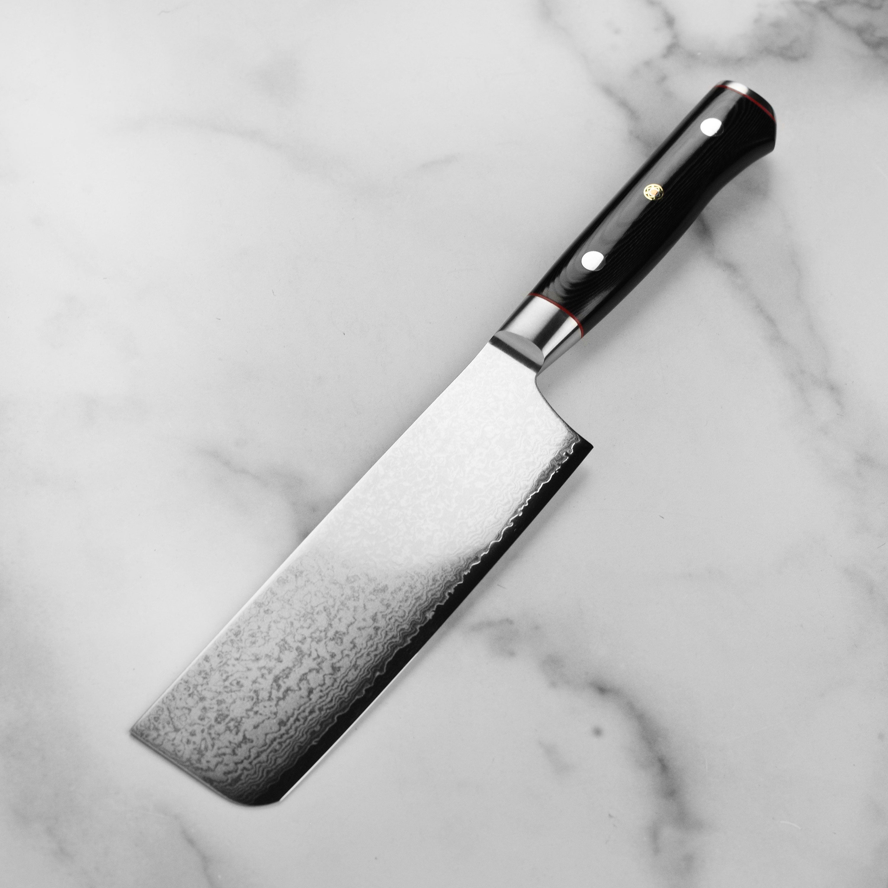 Side angle of black micarta handle with red spacer accents and mosaic pin