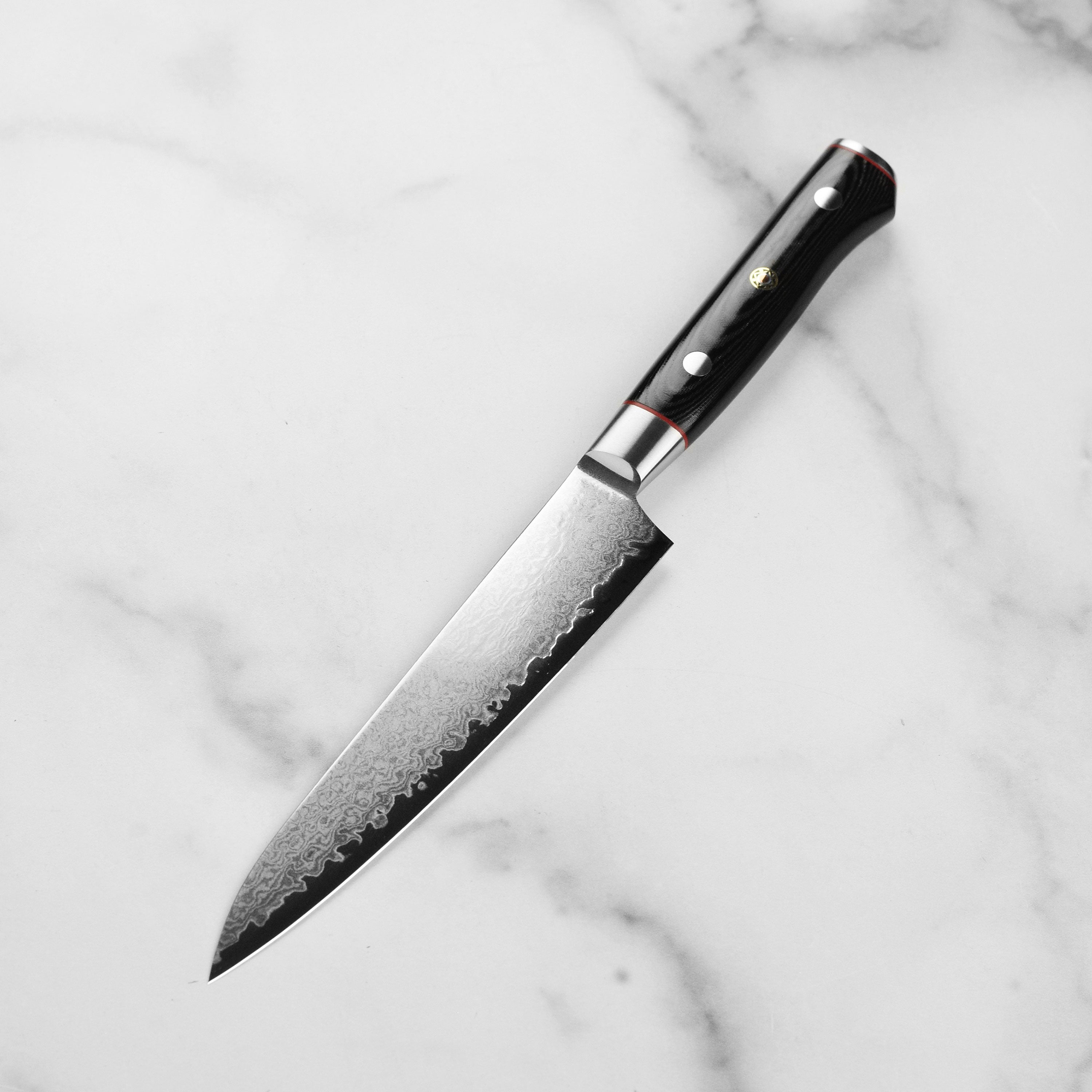 Close-up of the VG10 core and 33-layer Damascus steel of the petty knife