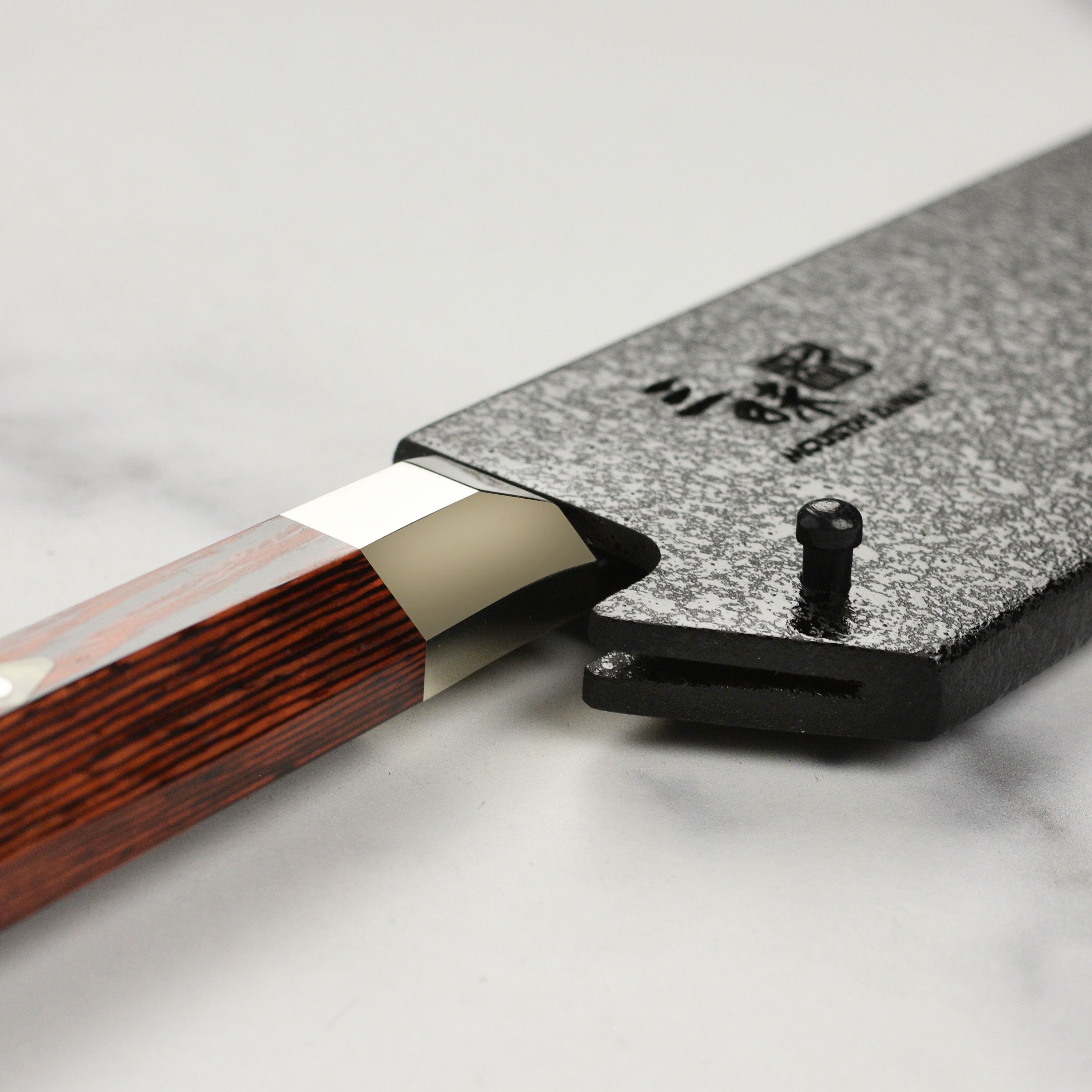 Premium black lacquer saya for 9.4" gyuto knife, showing the elegant finish and engravings.