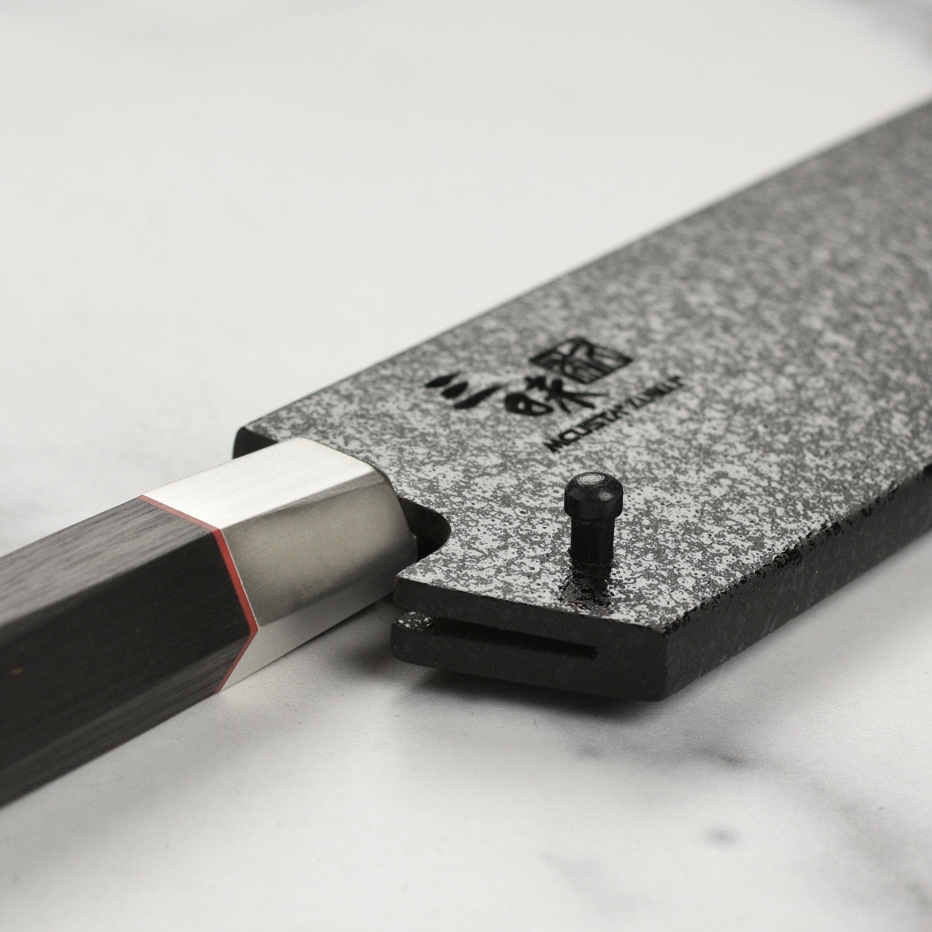 Side angle of the Black Lacquer Saya highlighting the secure fit for a 7" Santoku knife.