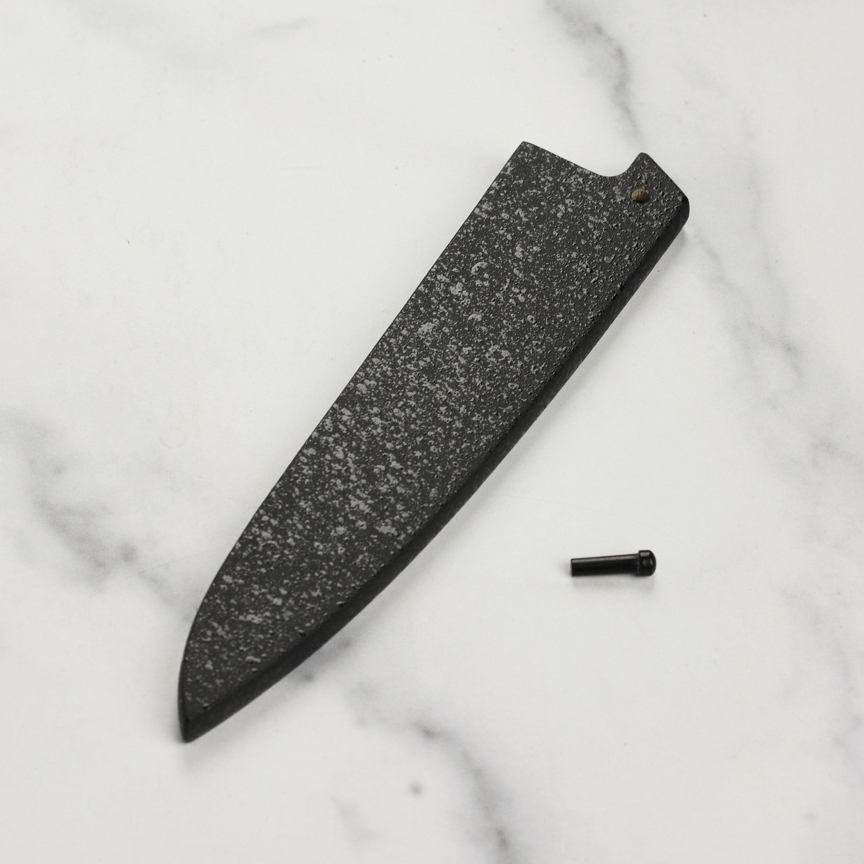 Display of the Japanese knife saya with a 5.9 inch petty knife securely stored.