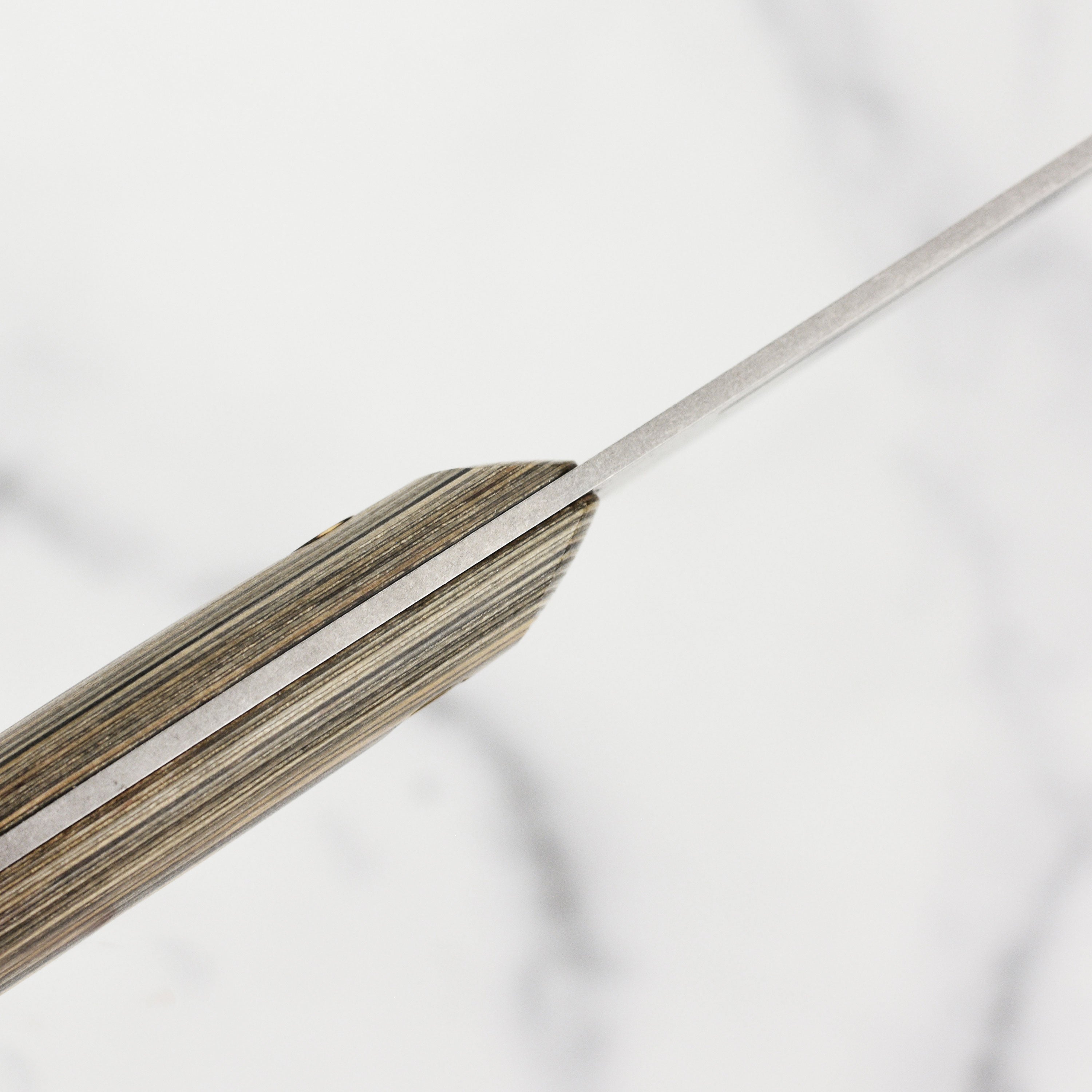 The 9-inch bread knife in action, effortlessly slicing through a fresh loaf of bread.