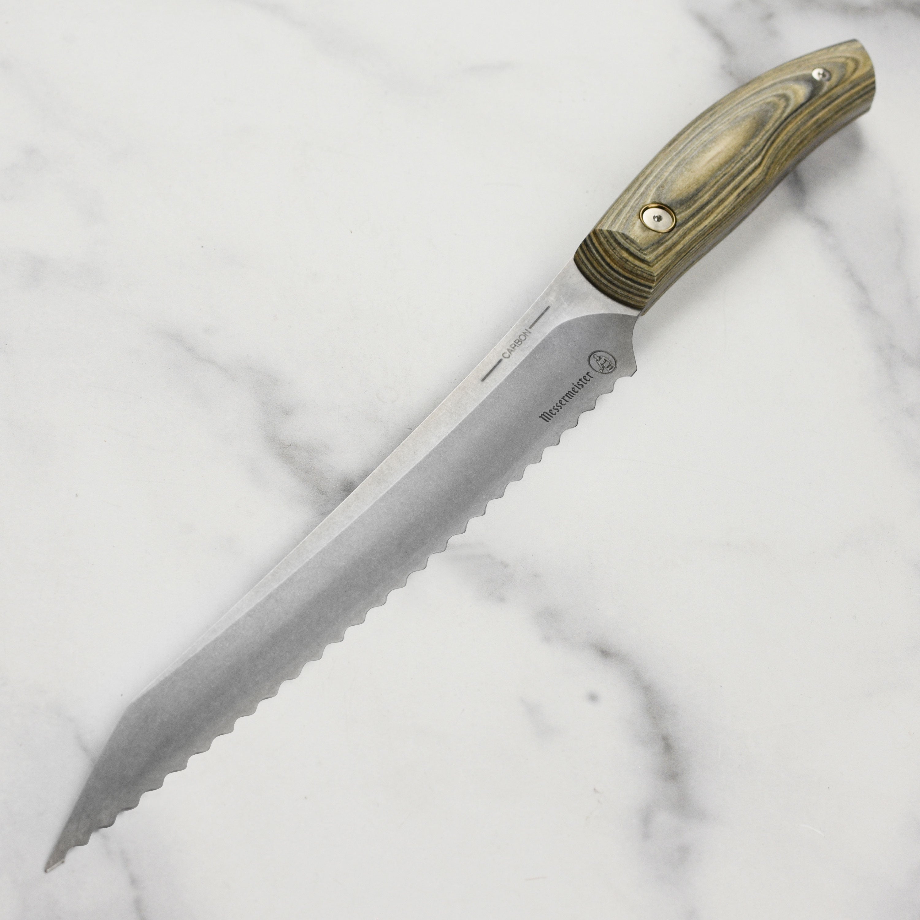 Artisan carbon steel bread knife showcasing the sharp blade and elegant handle.