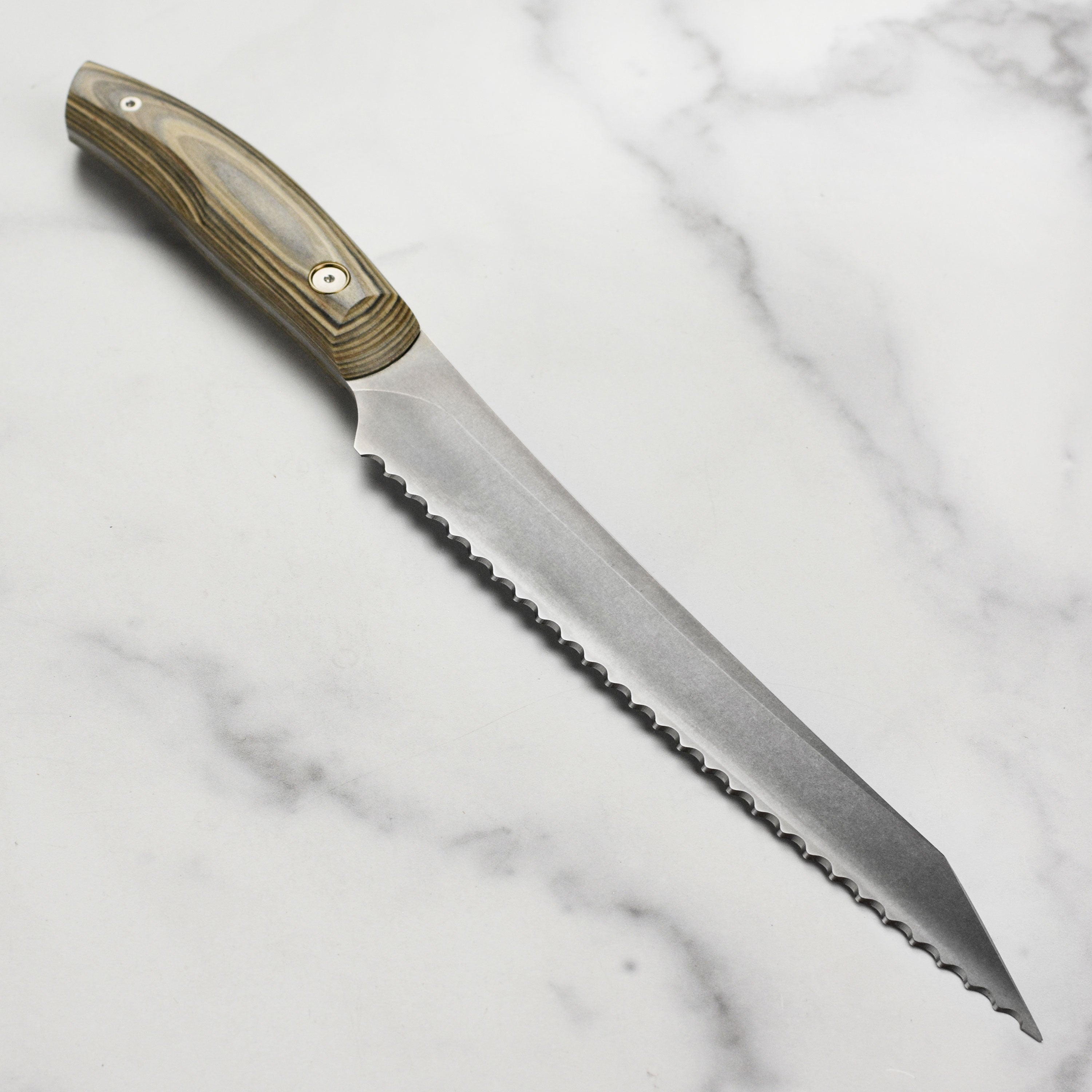 Close-up of the handcrafted knife demonstrating its ceramic stonewash finish.