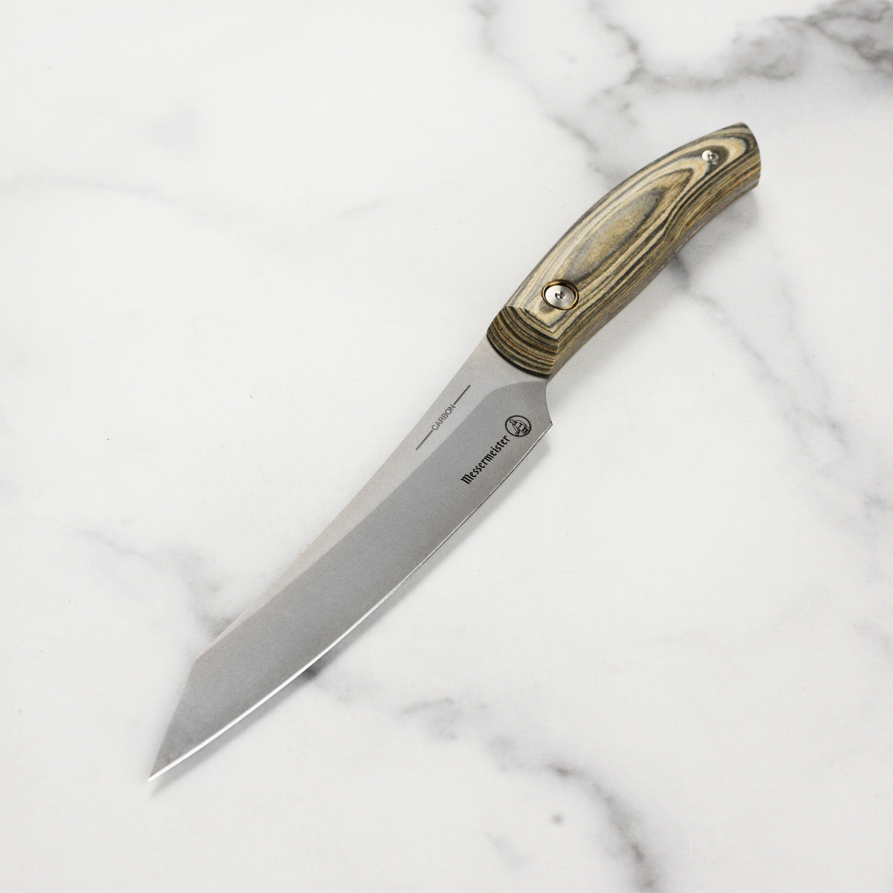 Close-up view of the Messermeister Artisan Carbon Utility Knife blade highlighting its carbon steel finish.