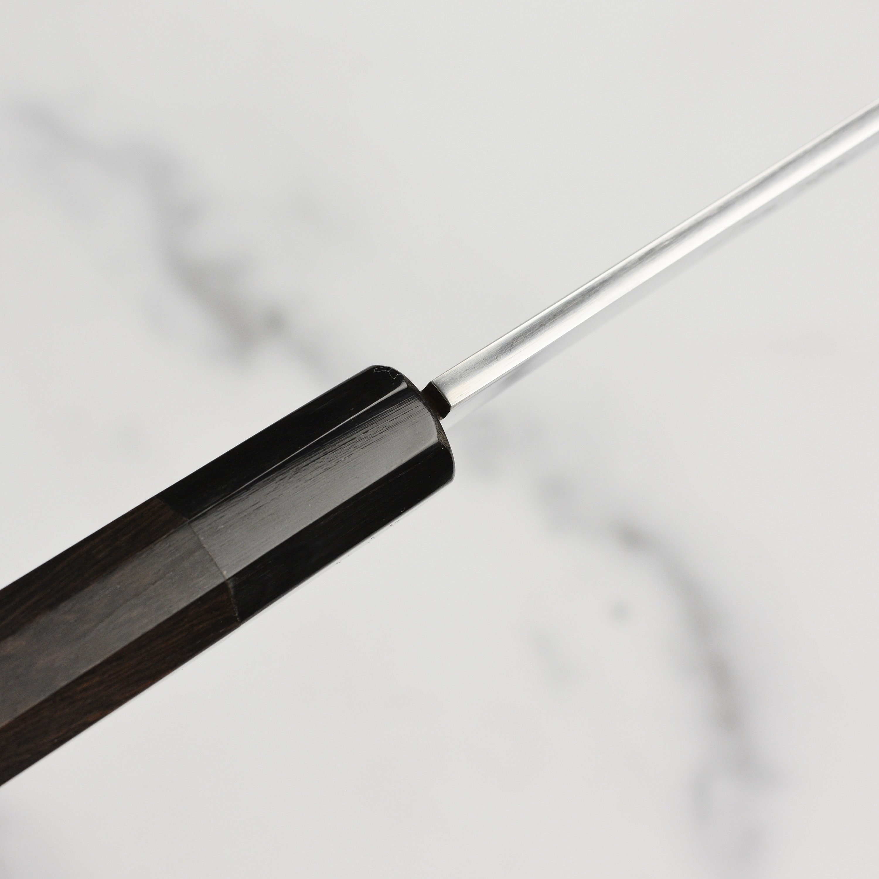 Handmade Japanese kitchen knife with ebony handle, perfect for sushi chefs