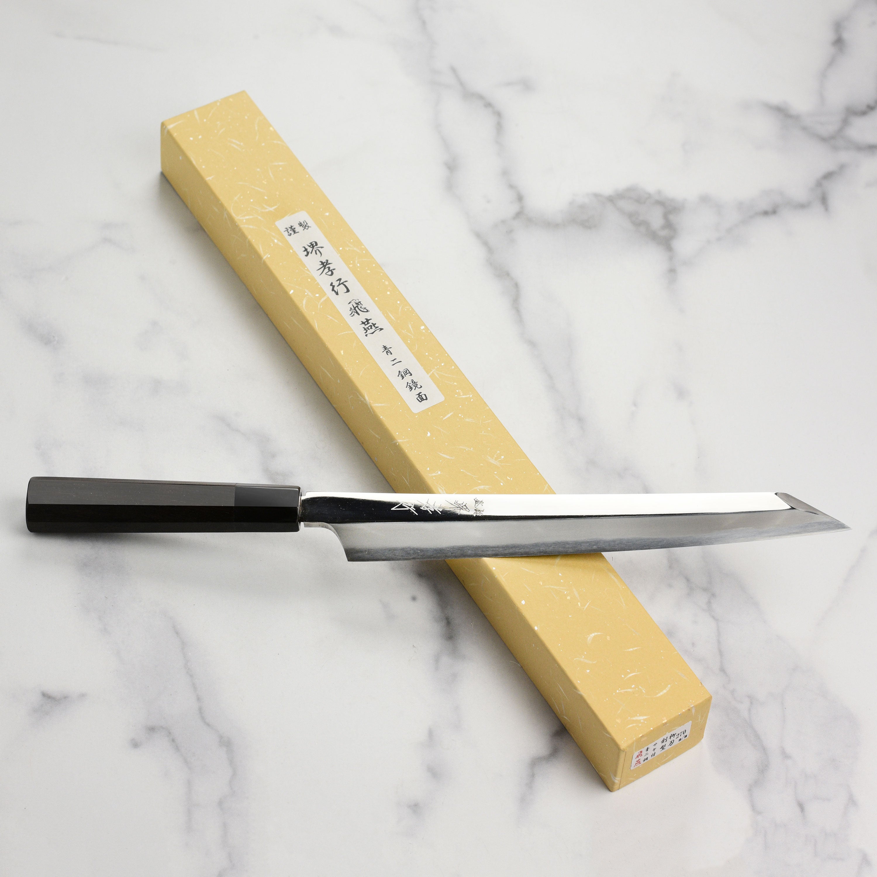Handmade Japanese kitchen knife with ebony handle, perfect for sushi chefs