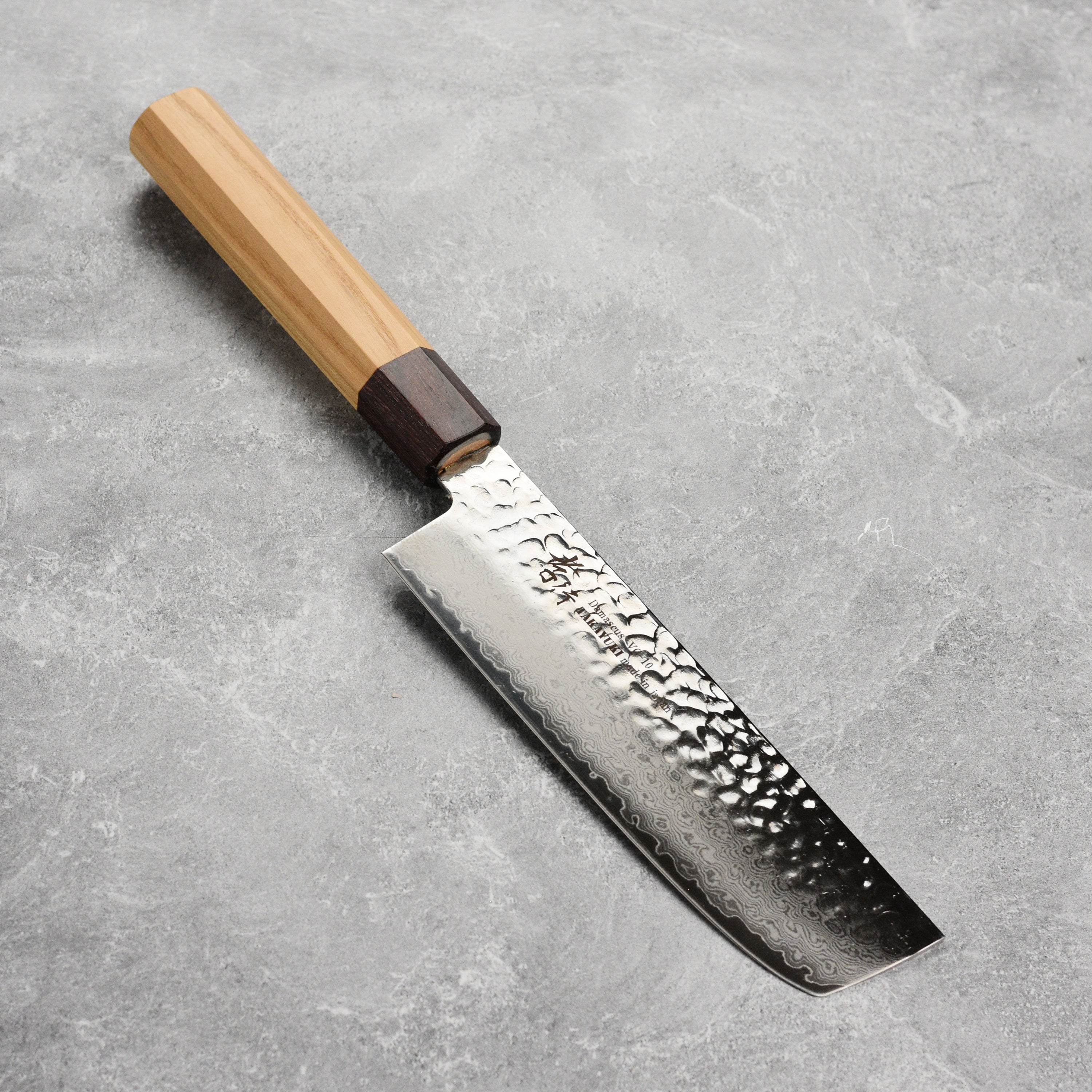Takayuki Damascus nakiri knife showcasing the beautiful blade and wooden handle from multiple angles
