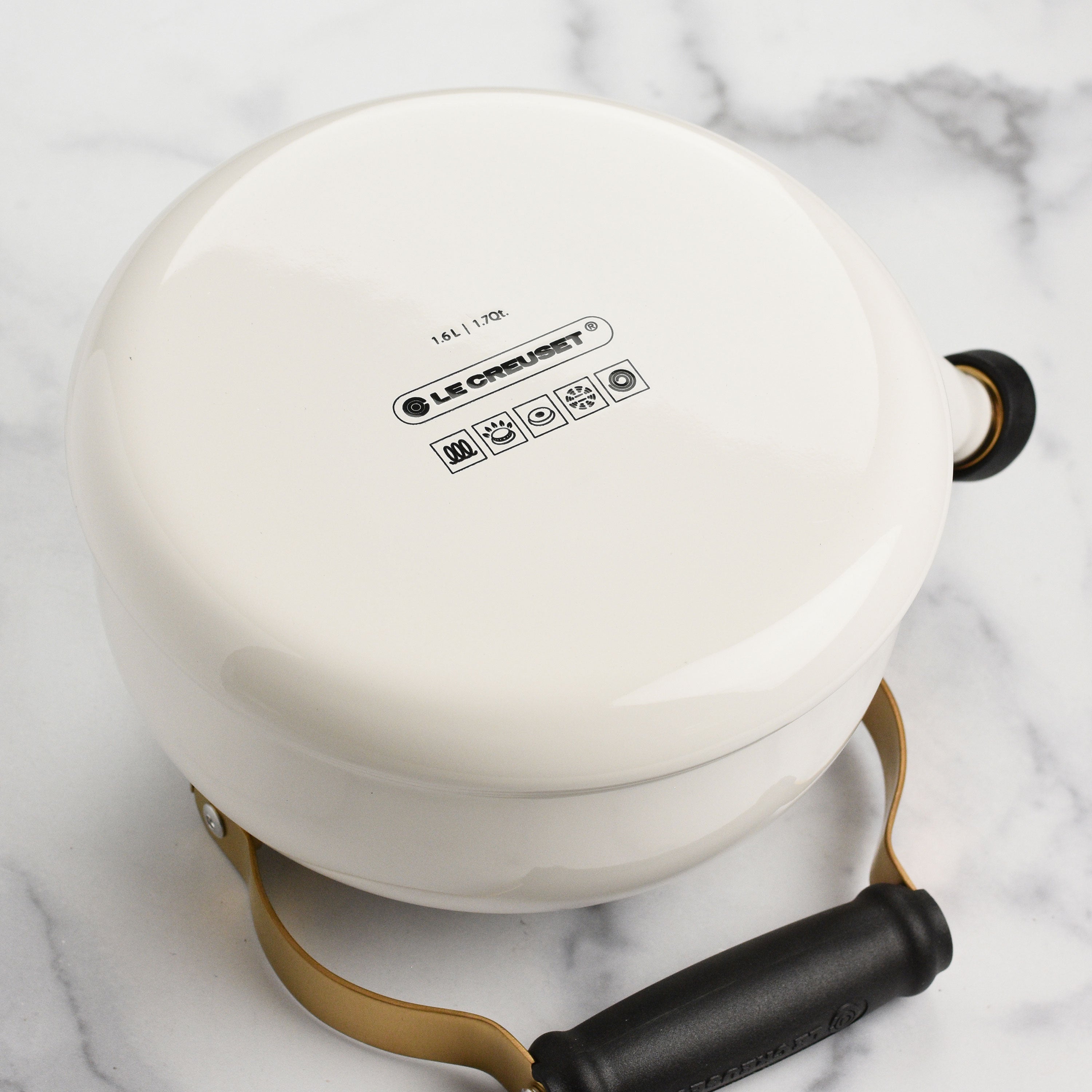 Close-up of the whistling kettle spout, highlighting the easy-open feature for pouring.