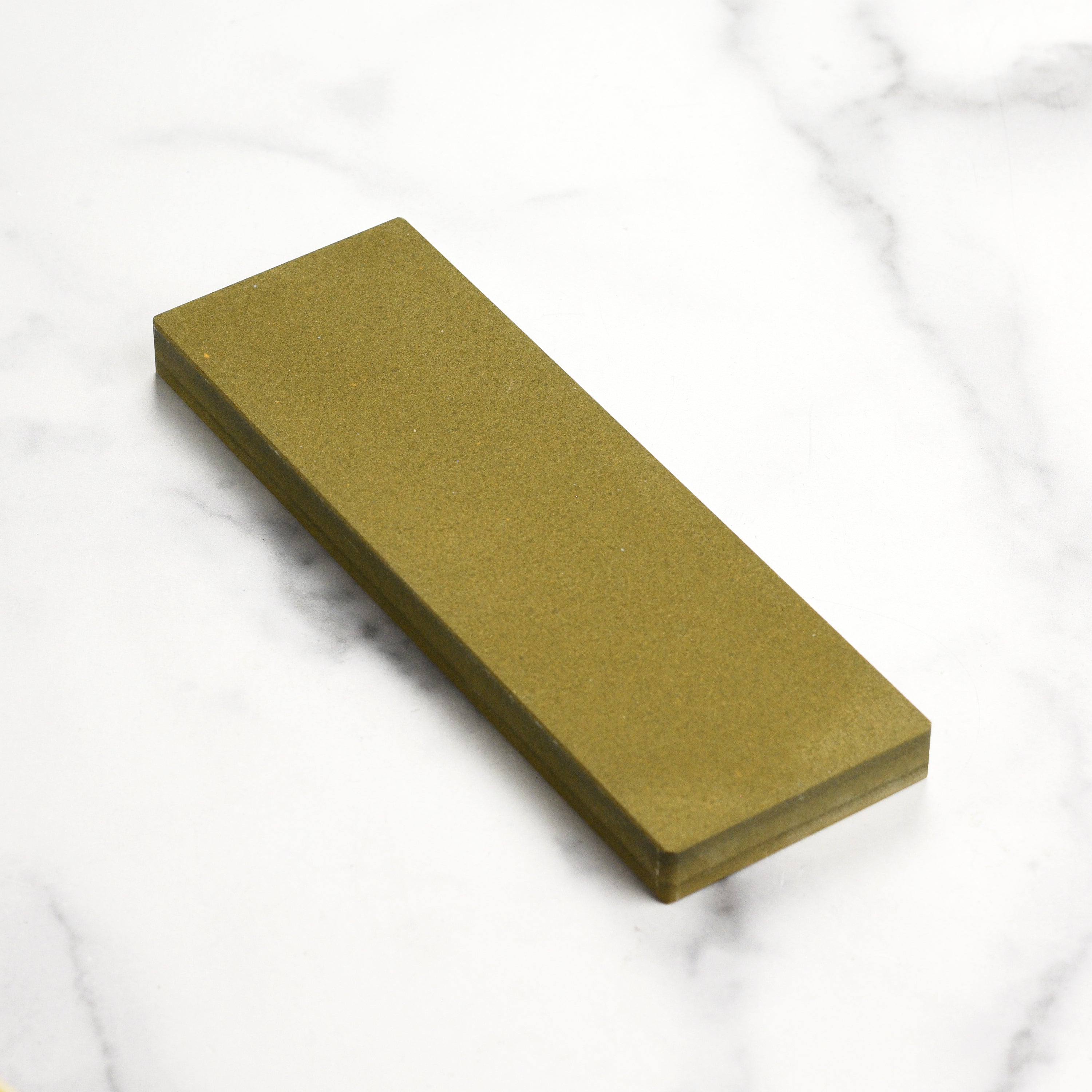 Shapton Kuromaku 220 grit water stone with plastic case displayed