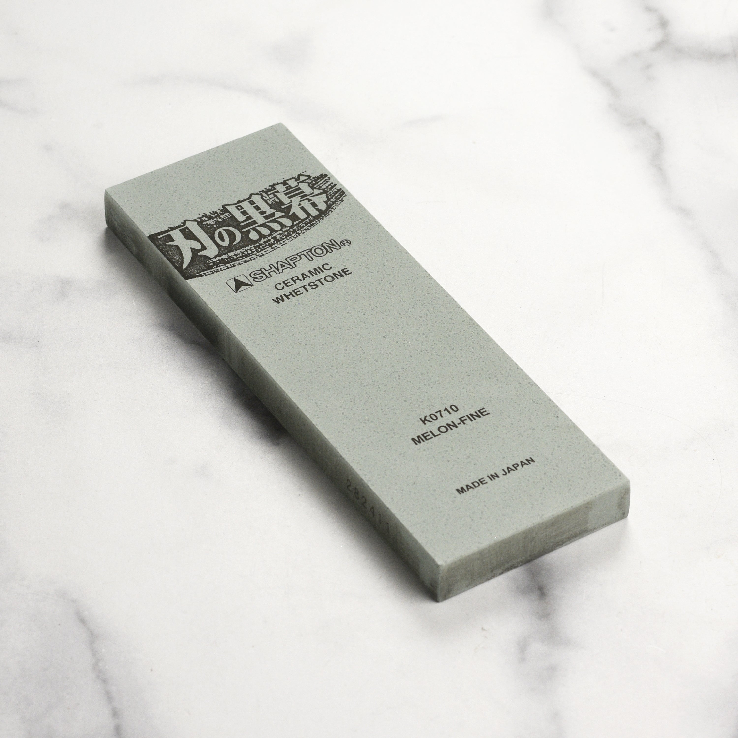 Shapton Kuromaku 8,000 grit stone in its plastic case, ready for use in knife sharpening.
