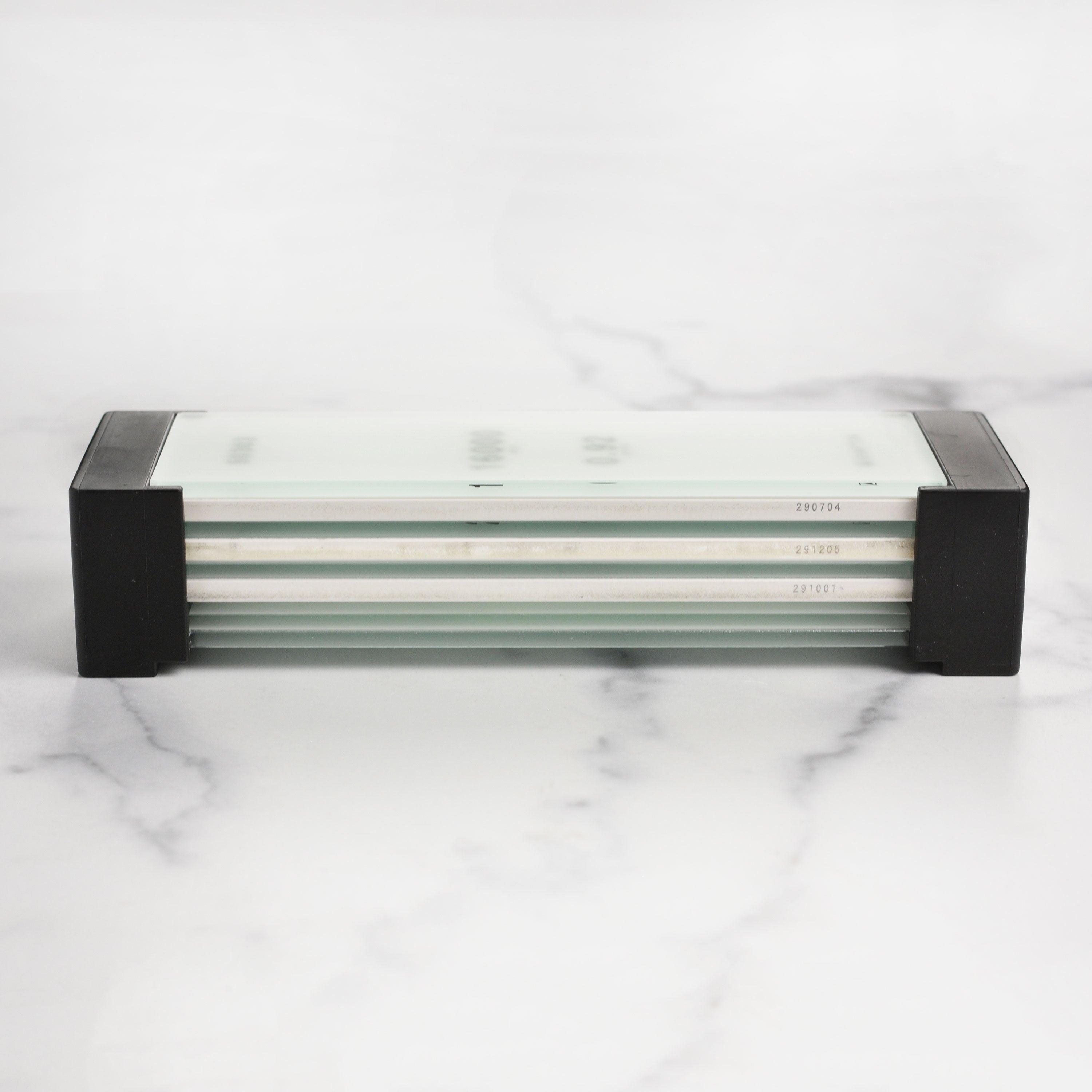 Close-up of the Shapton Glass Stone Holder used as a sharpening base for knives
