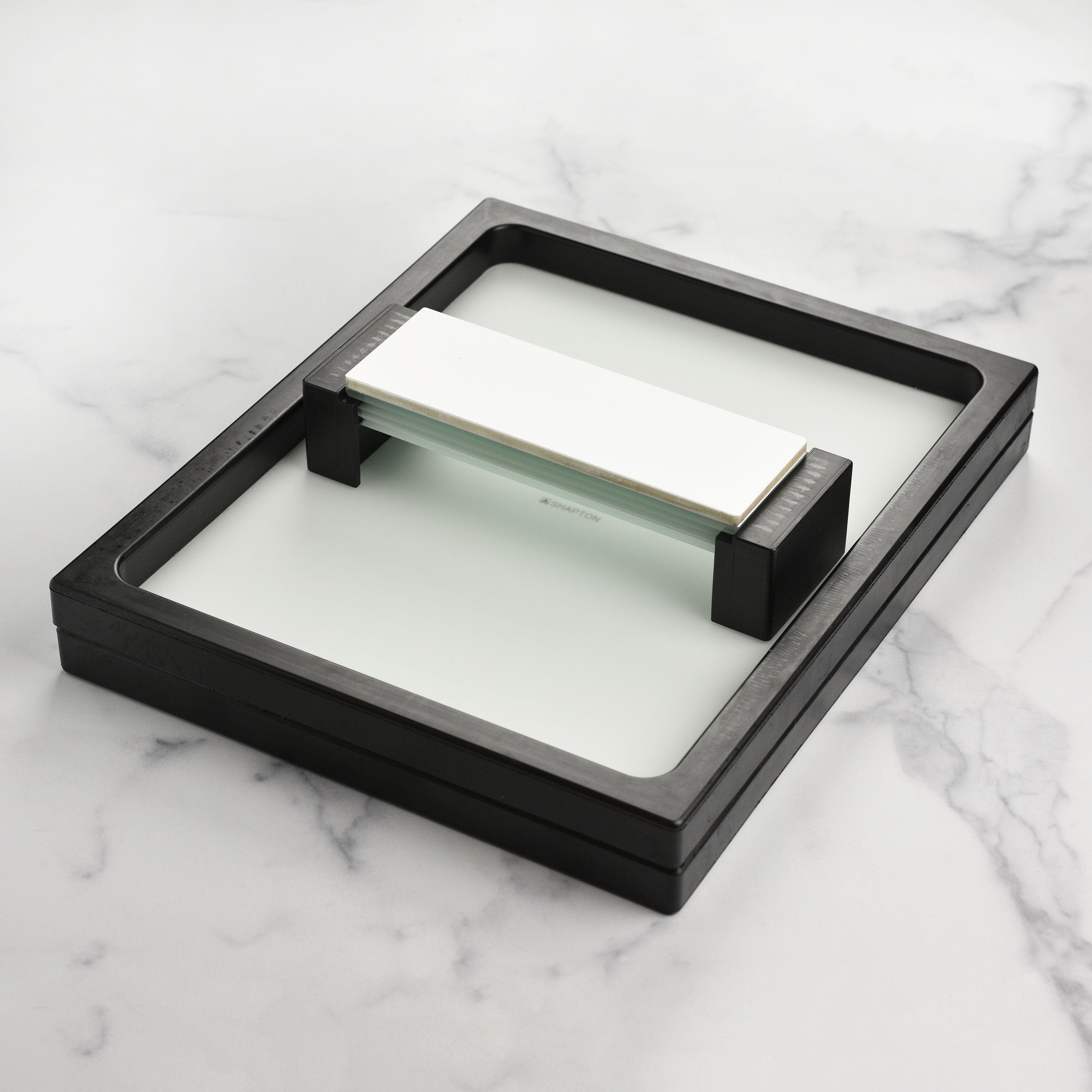 Shapton sharpening pond with textured glass surface for secure knife sharpening