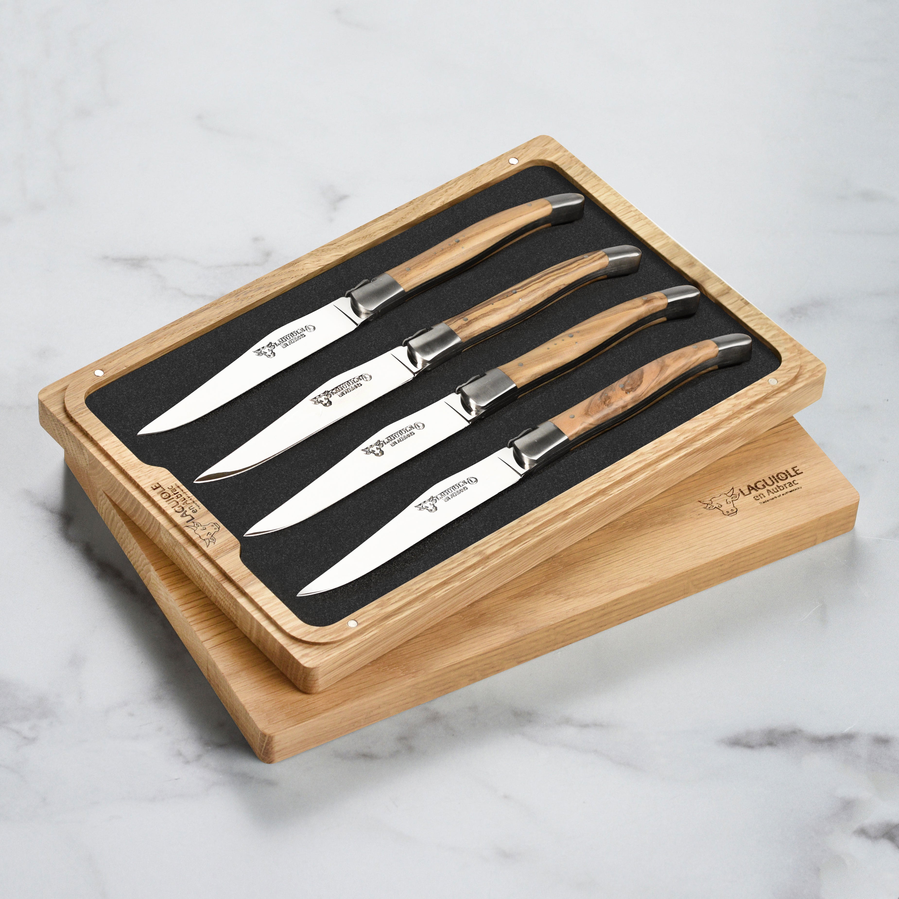 Close-up of olive wood handle on Laguiole steak knives showing craftsmanship